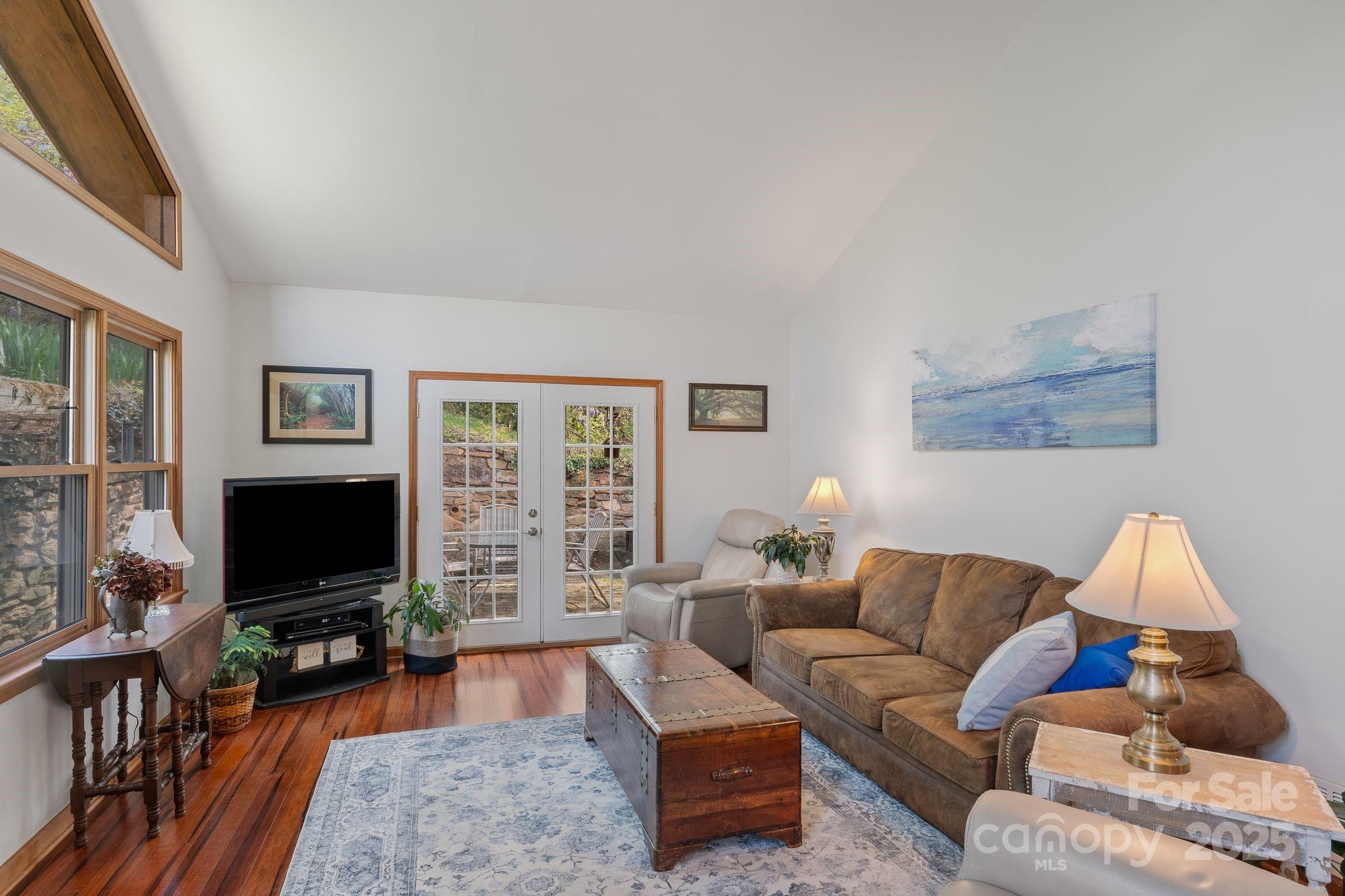 22 Morgan Branch Road Weaverville, NC 28787 - Photo 12 of 47 a living room with furniture and a flat screen tv