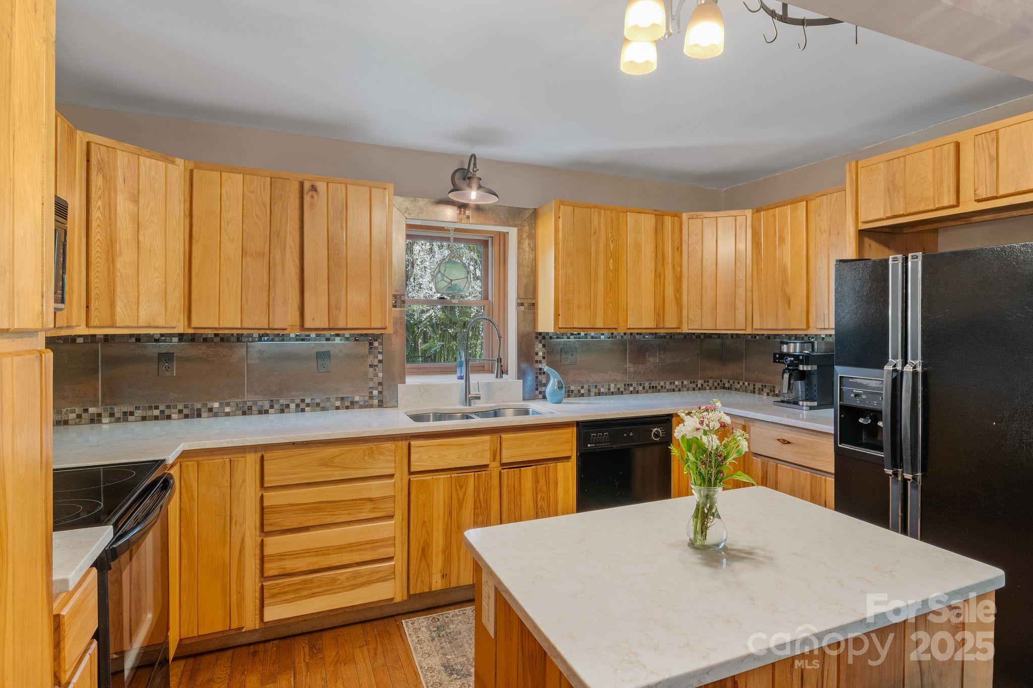22 Morgan Branch Road Weaverville, NC 28787 - Photo 14 of 47 a kitchen with stainless steel appliances granite countertop a sink a stove and refrigerator