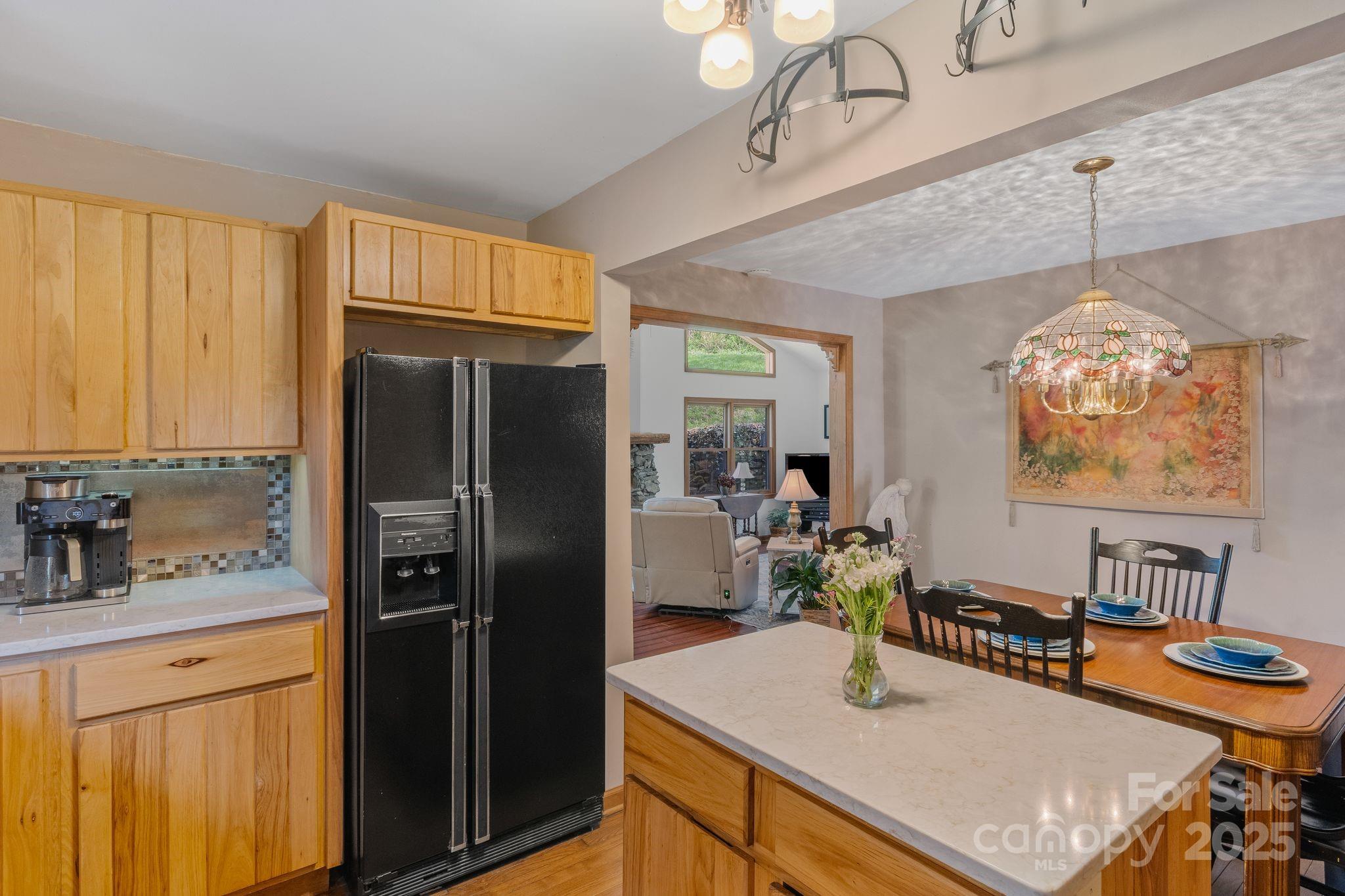 22 Morgan Branch Road Weaverville, NC 28787 - Photo 15 of 47 a kitchen with stainless steel appliances a refrigerator a sink a stove and island