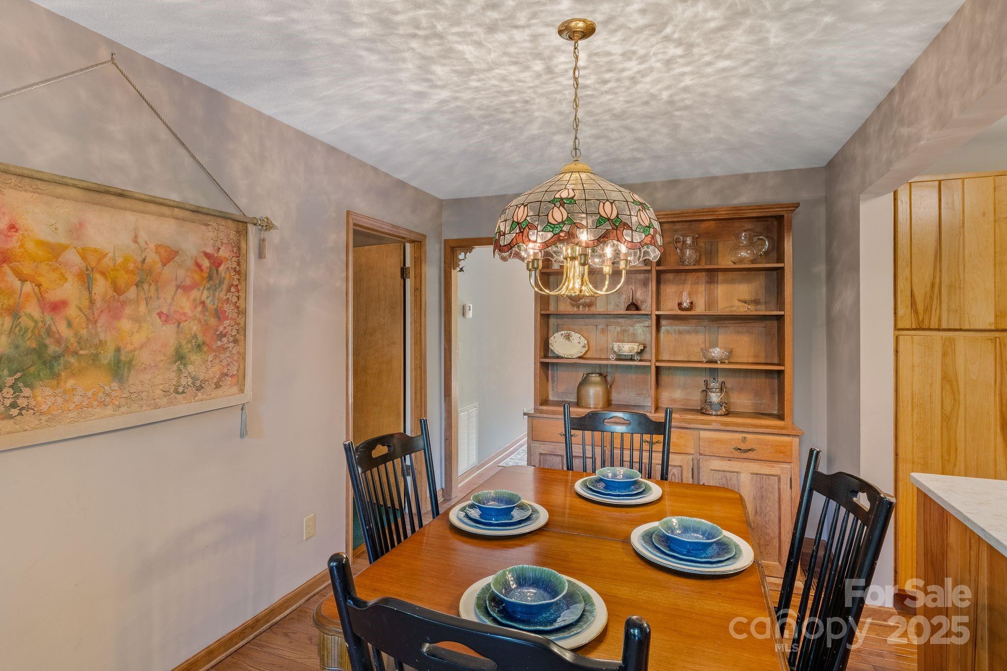 22 Morgan Branch Road Weaverville, NC 28787 - Photo 18 of 47 a view of a dining room with furniture and chandelier