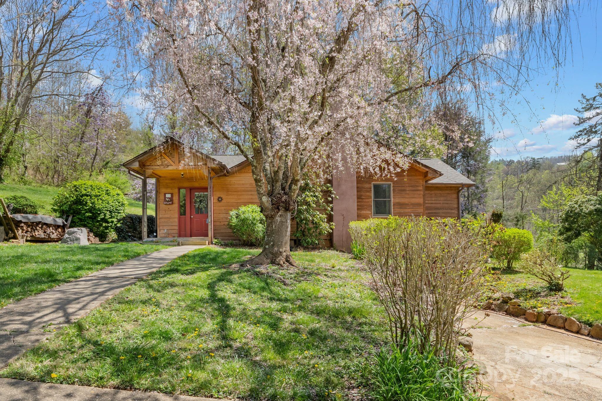 22 Morgan Branch Road Weaverville, NC 28787 - Photo 2 of 47 a front view of a house with a yard