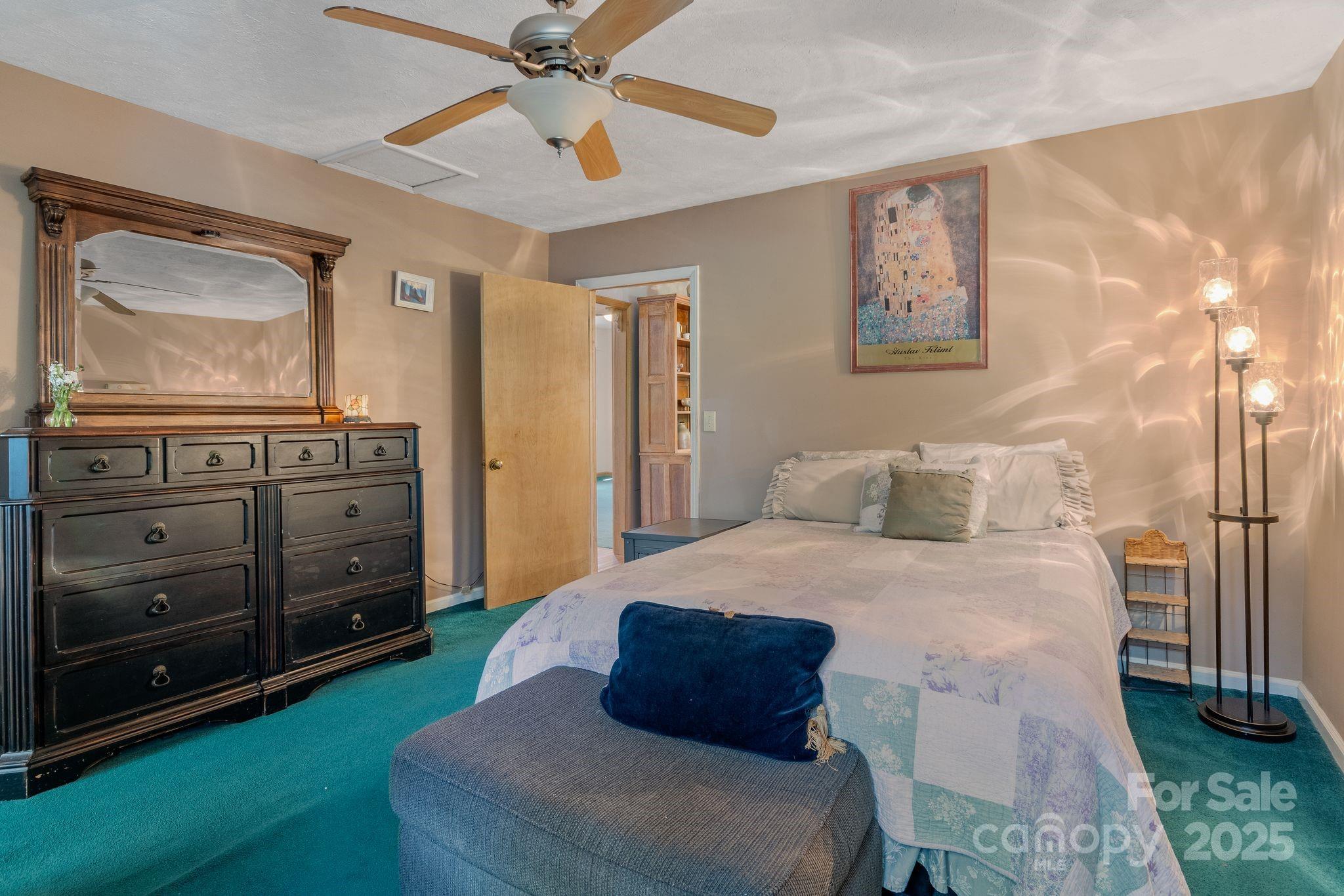 22 Morgan Branch Road Weaverville, NC 28787 - Photo 21 of 47 a bedroom with a bed and a dresser