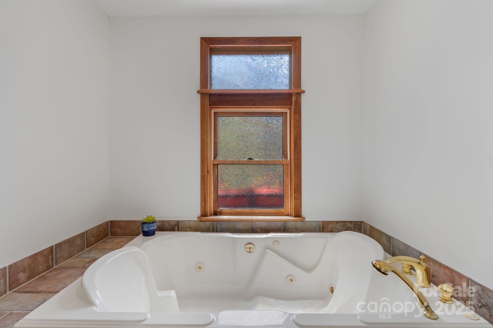 22 Morgan Branch Road Weaverville, NC 28787 - Photo 24 of 47 a bathroom with a tub and a window