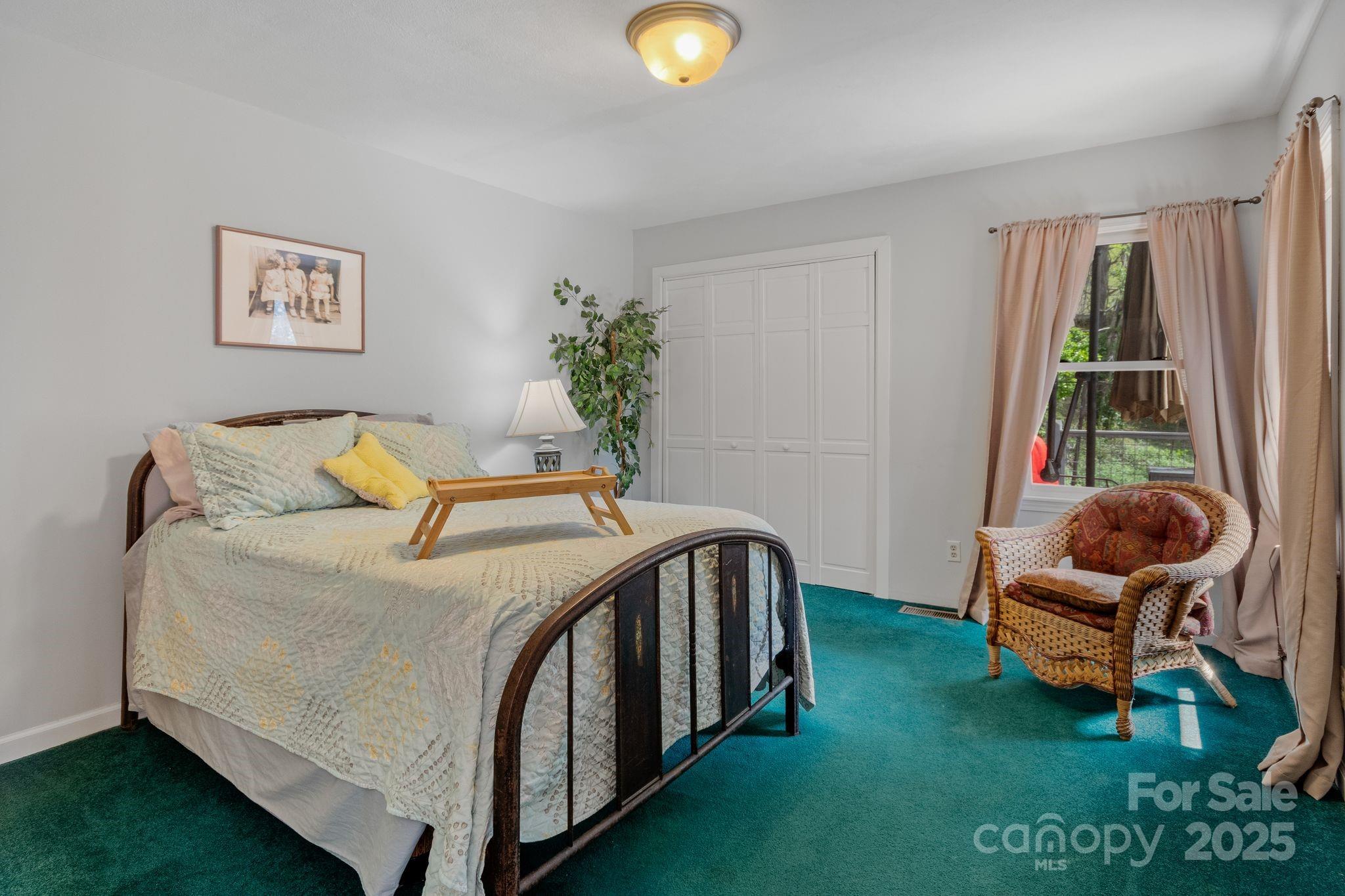 22 Morgan Branch Road Weaverville, NC 28787 - Photo 27 of 47 a bedroom with bed and a window