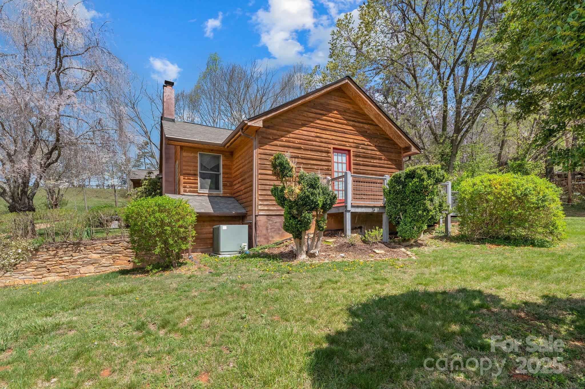 22 Morgan Branch Road Weaverville, NC 28787 - Photo 39 of 47 a view of a house with backyard and sitting area