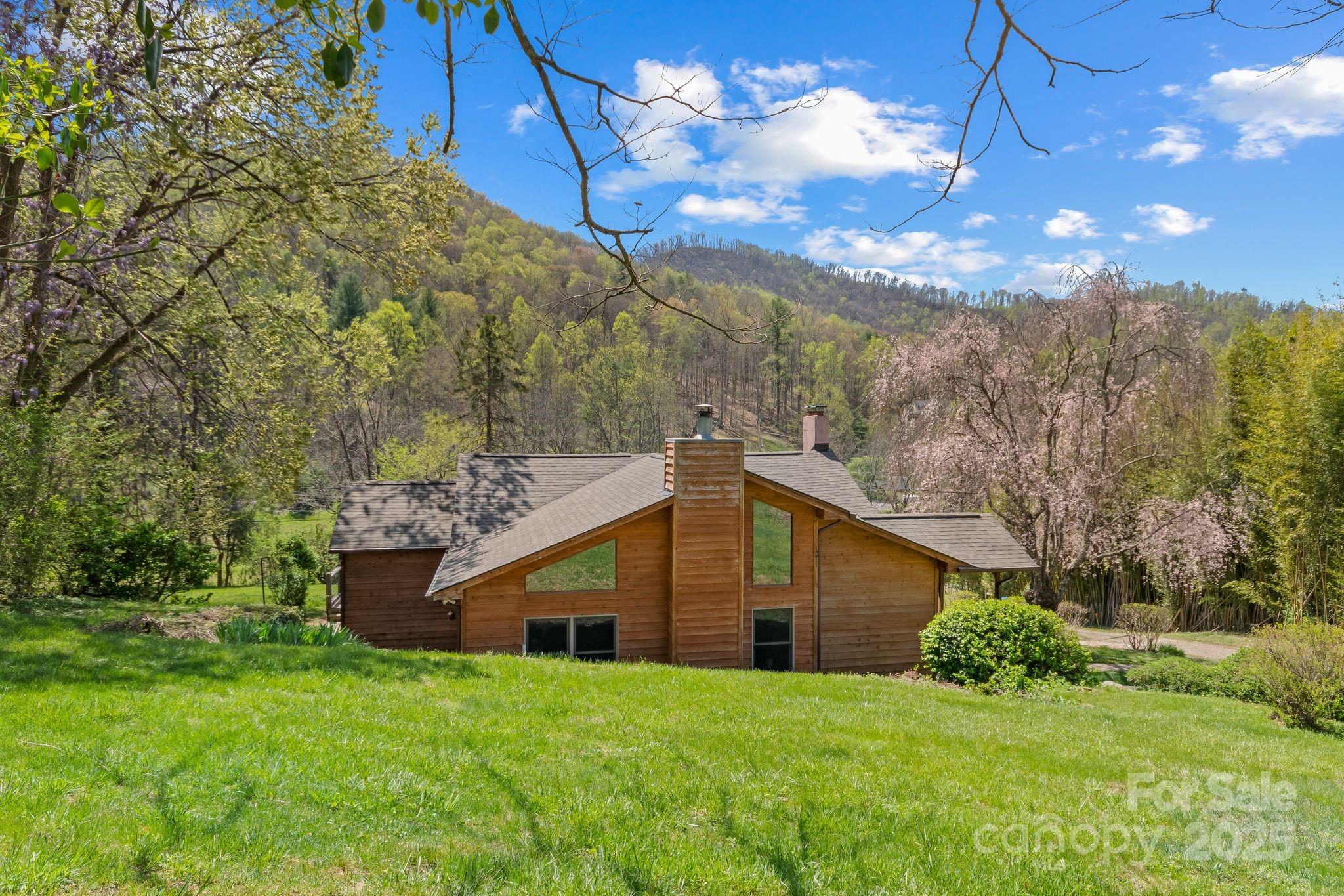 22 Morgan Branch Road Weaverville, NC 28787 - Photo 42 of 47 a view of a house with a yard