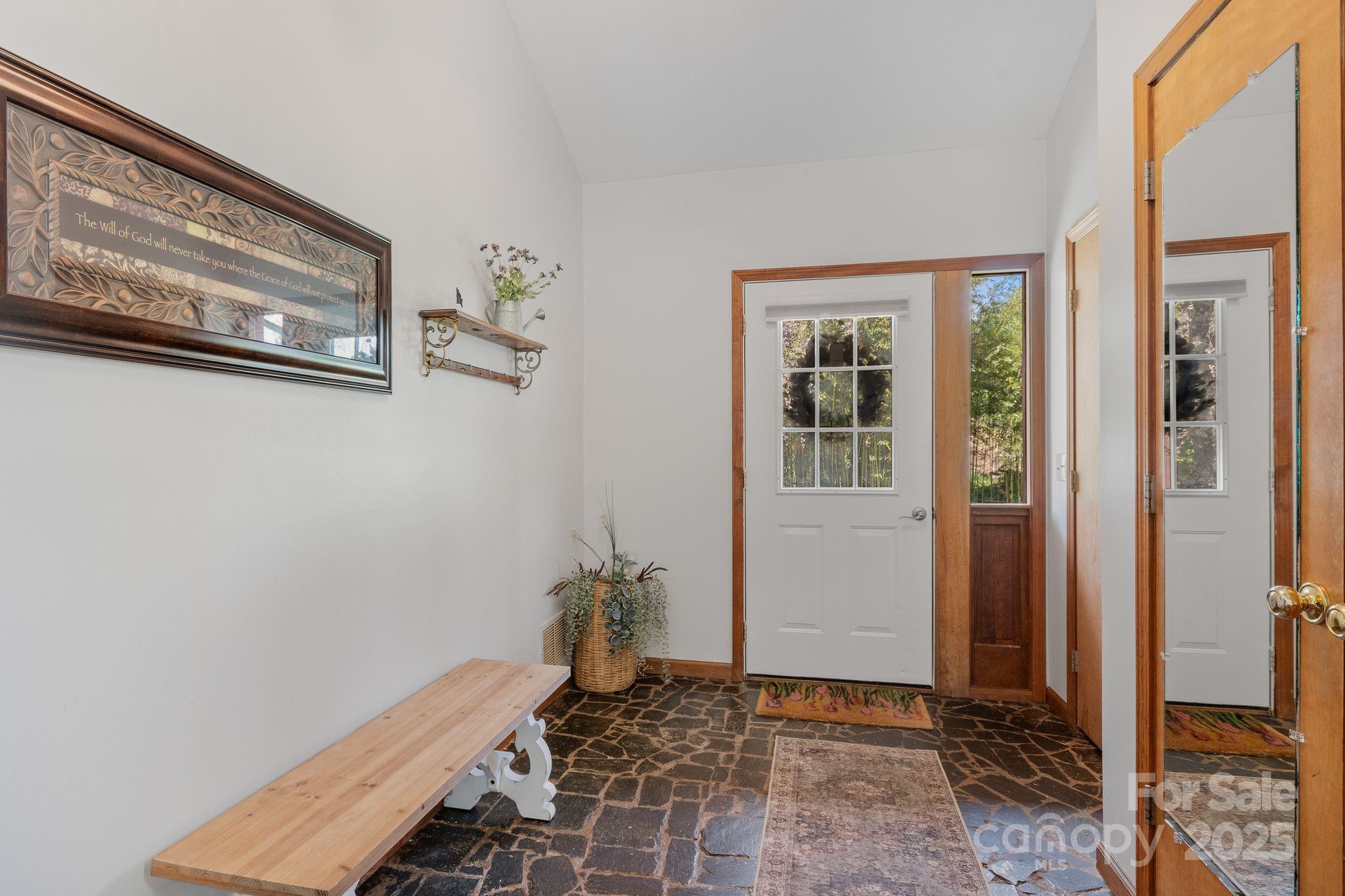 22 Morgan Branch Road Weaverville, NC 28787 - Photo 7 of 47 a view of a hallway with paintings on the wall