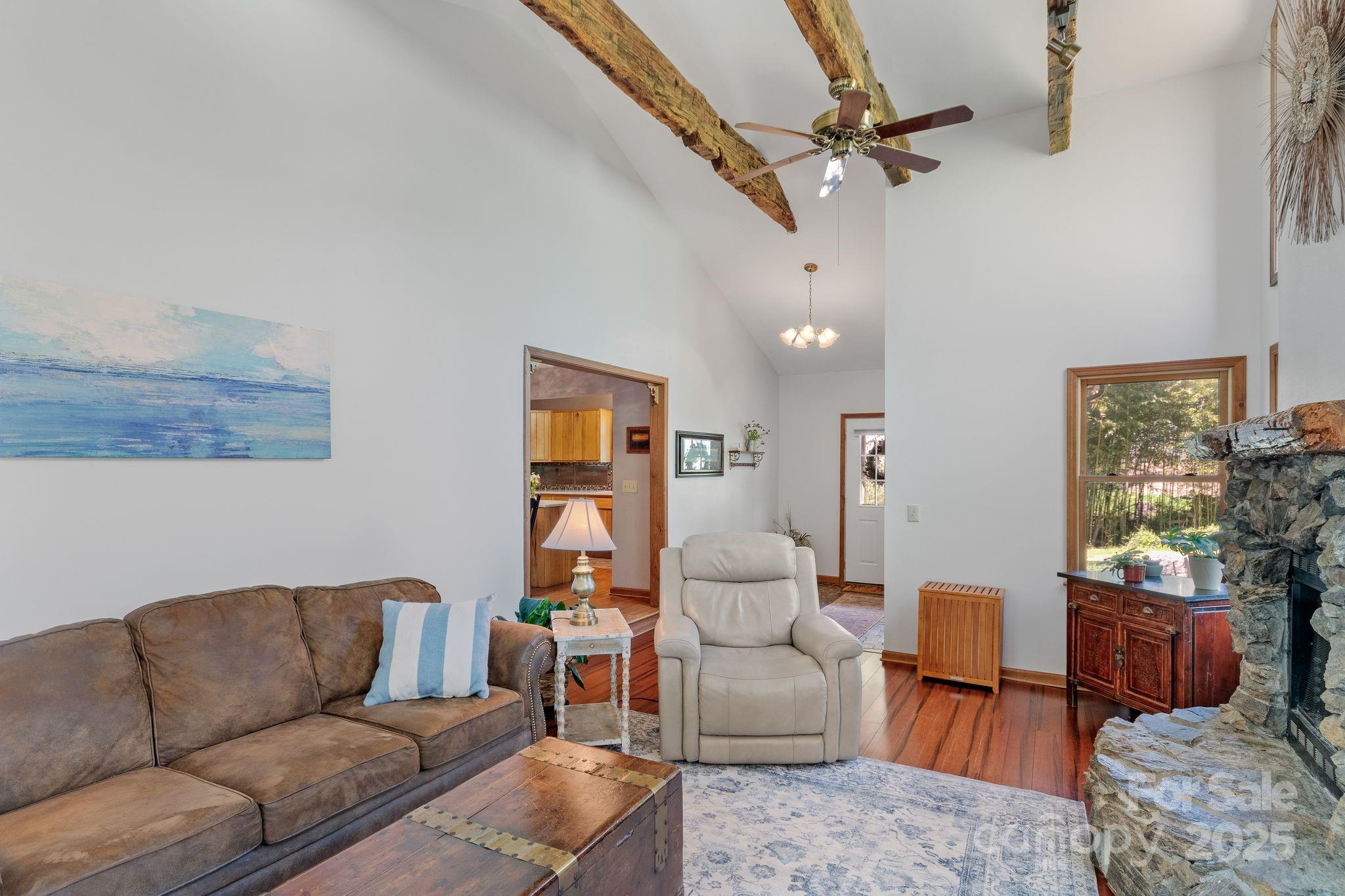 22 Morgan Branch Road Weaverville, NC 28787 - Photo 9 of 47 a living room with furniture and a chandelier