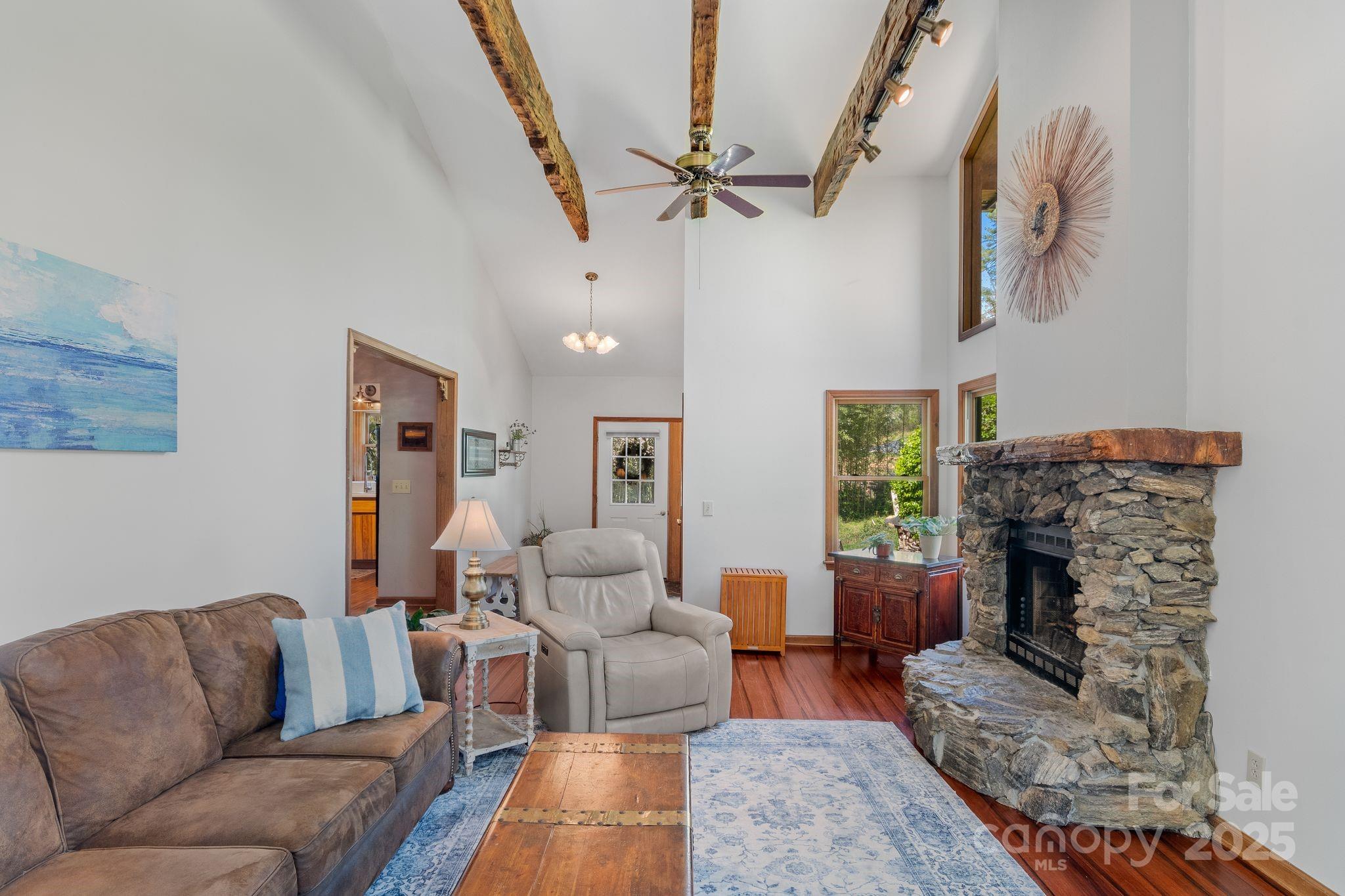 22 Morgan Branch Road Weaverville, NC 28787 - Photo 10 of 47 a living room with furniture and a fireplace