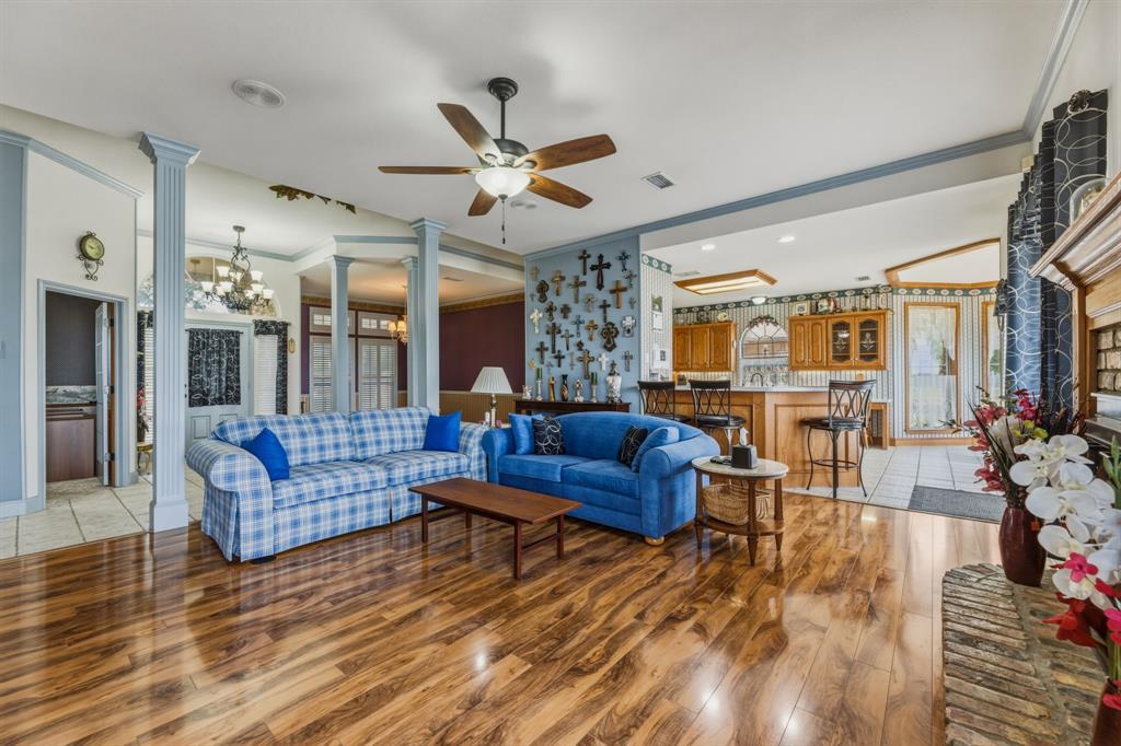130 Blazek Road Alma, TX 75119 - Photo 11 of 34 a living room with furniture and wooden floor