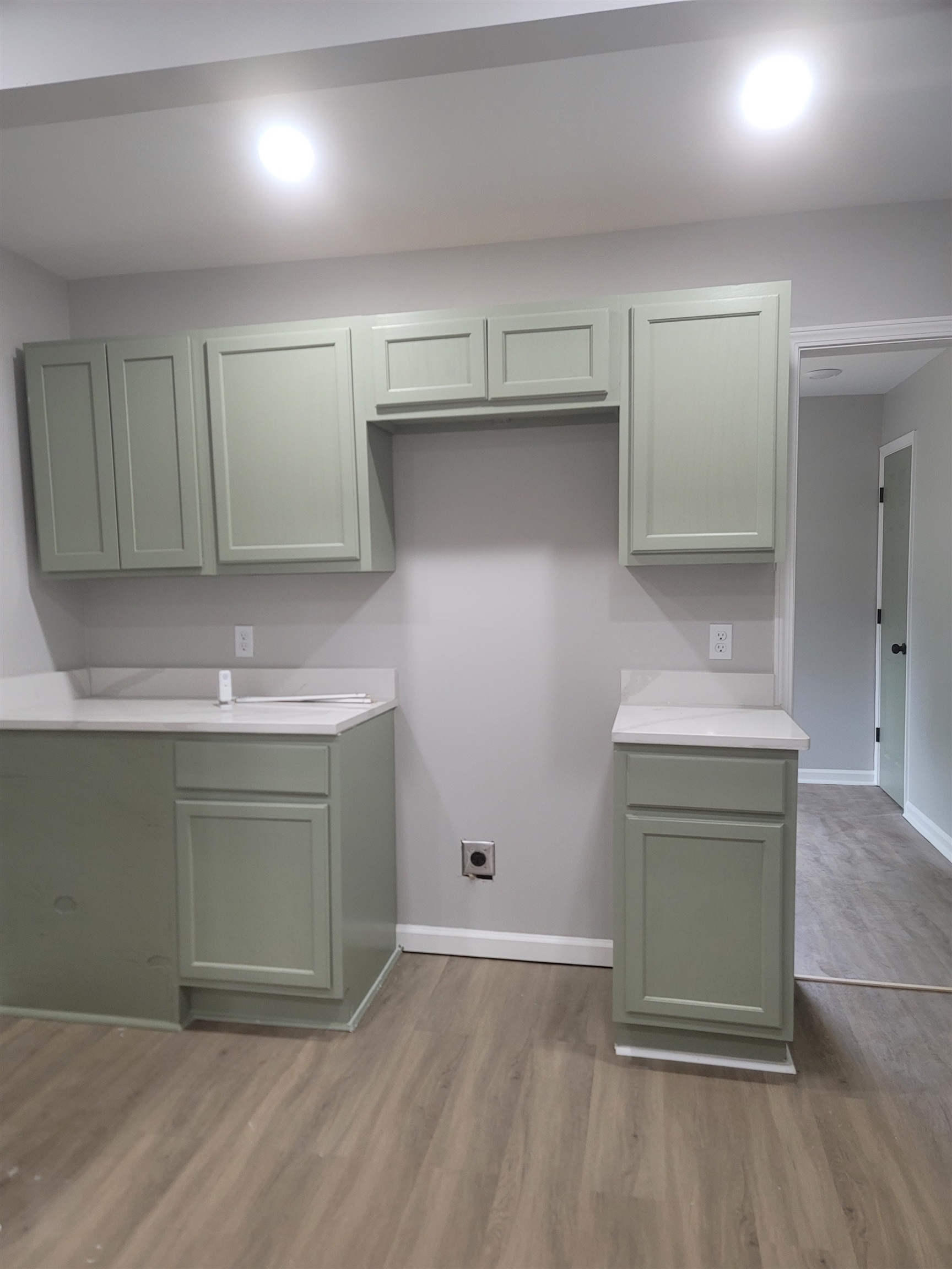 1434 Eloise Road Memphis, TN 38106 - Photo 14 of 19 an empty room with wooden floor and cabinet