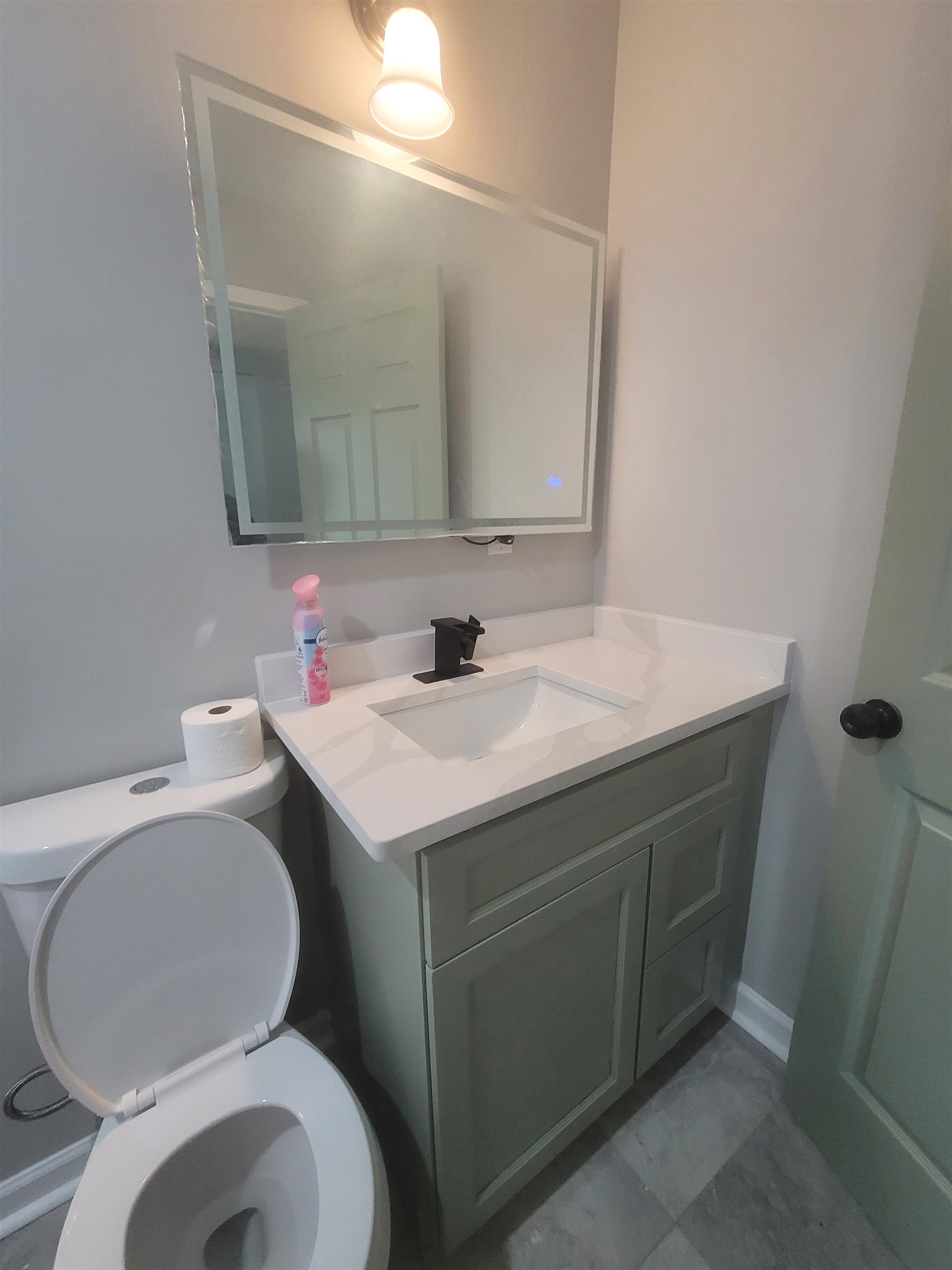 1434 Eloise Road Memphis, TN 38106 - Photo 15 of 19 a bathroom with a sink and a mirror