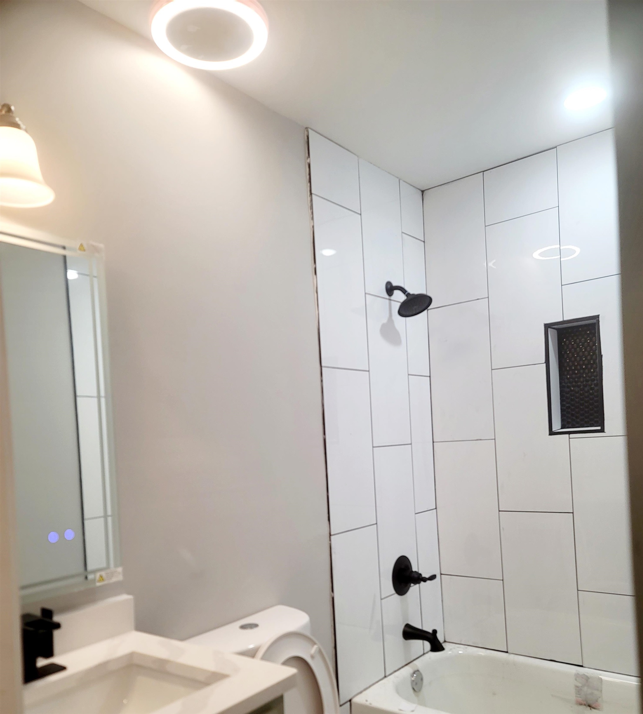 1434 Eloise Road Memphis, TN 38106 - Photo 17 of 19 a bathroom with a sink and a mirror