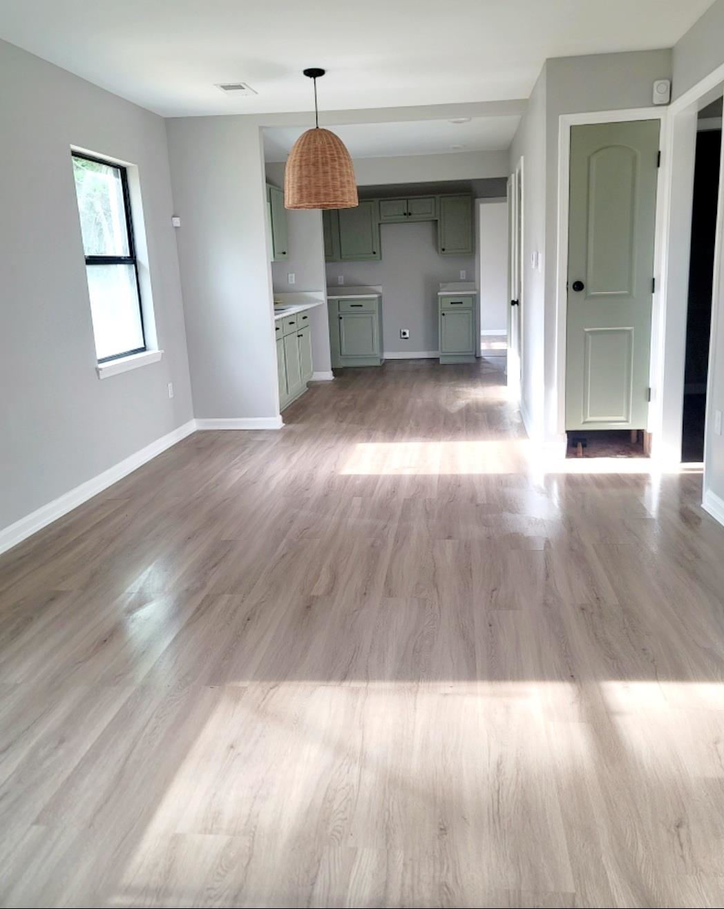 1434 Eloise Road Memphis, TN 38106 - Photo 4 of 19 a view of a kitchen with wooden floor and sink