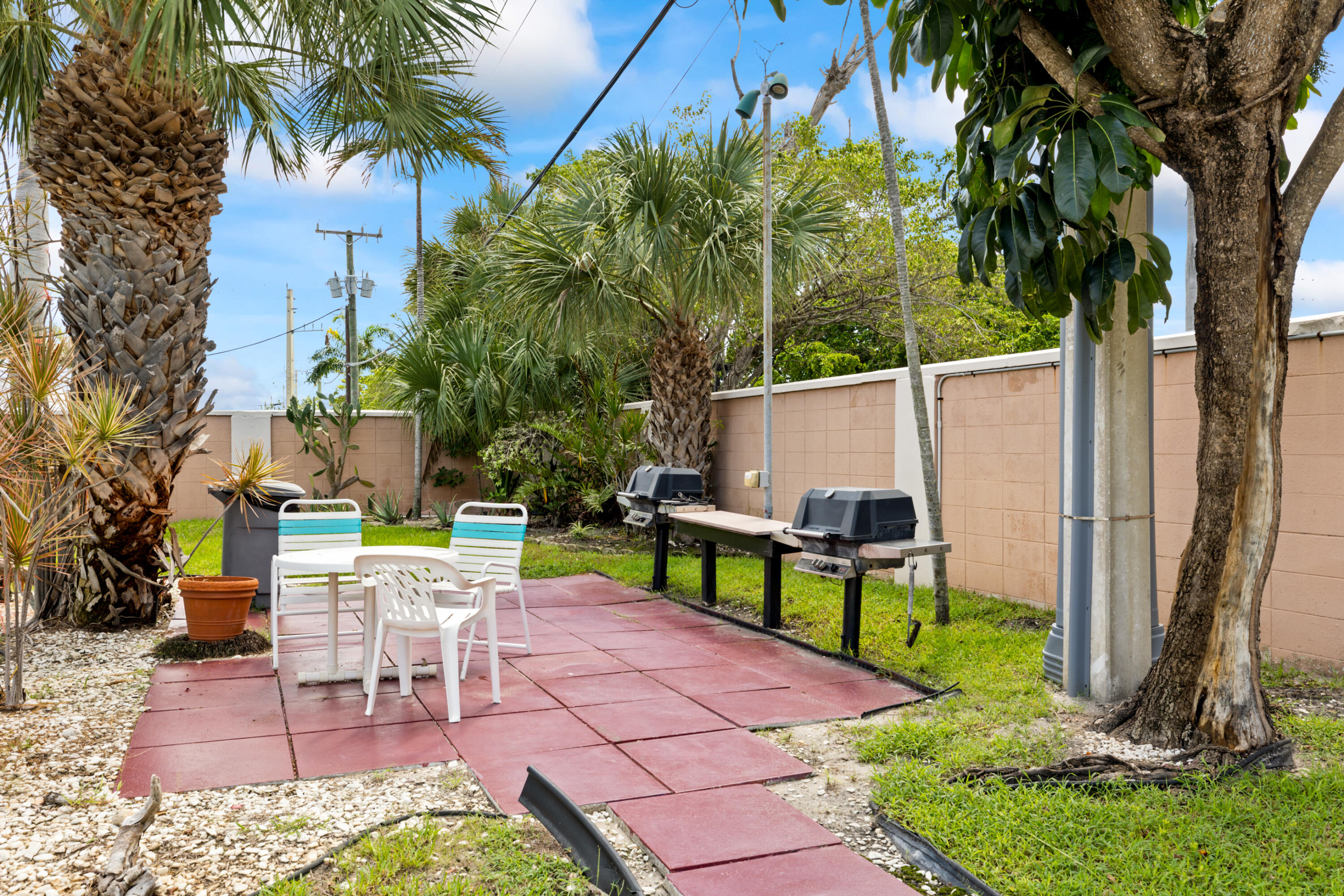 400 Northeast 20th Street, Unit B108 Boca Raton, FL 33431 - Photo 21 of 31 a view of a chairs and table in the patio