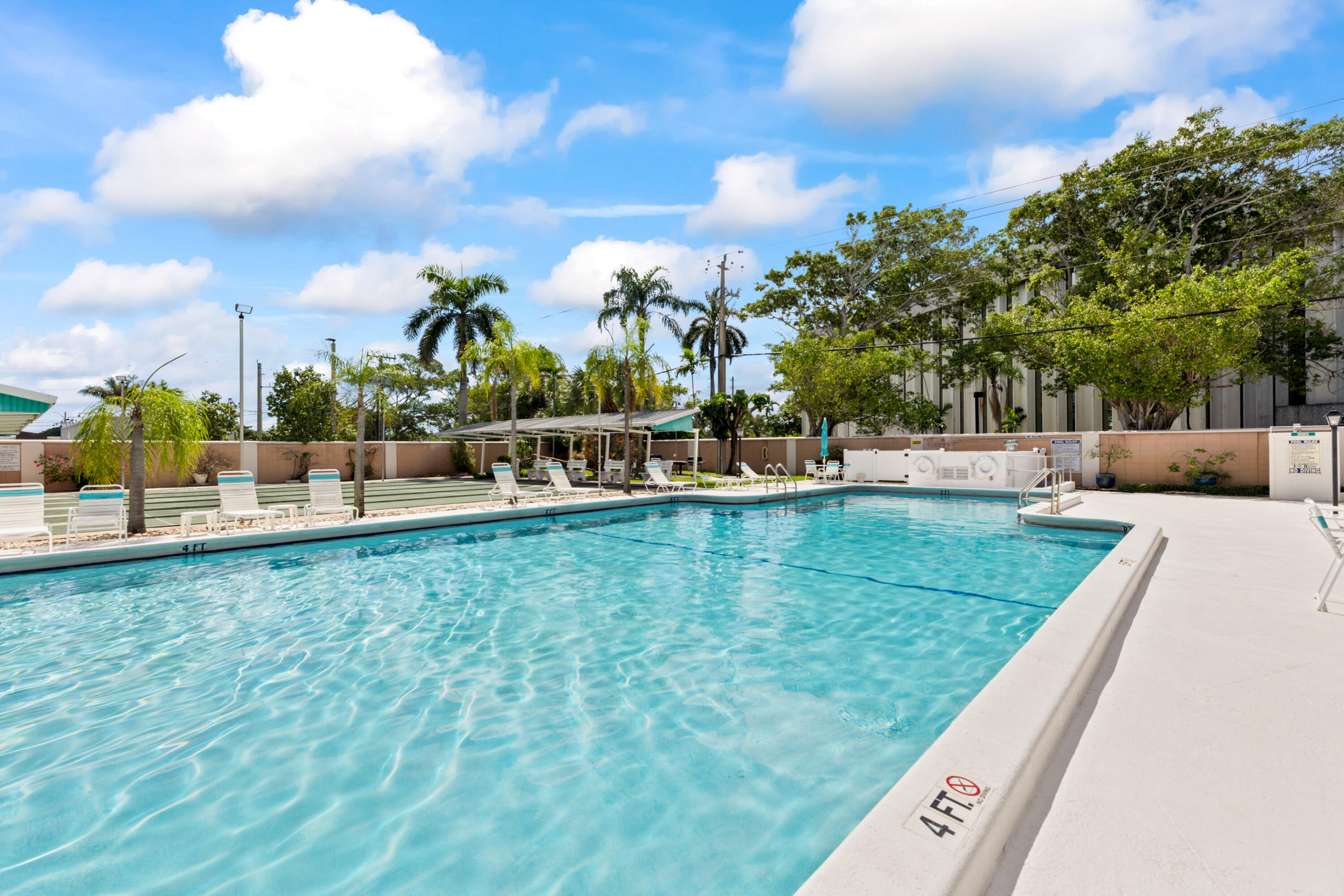 400 Northeast 20th Street, Unit B108 Boca Raton, FL 33431 - Photo 23 of 31 a view of a swimming pool with a patio