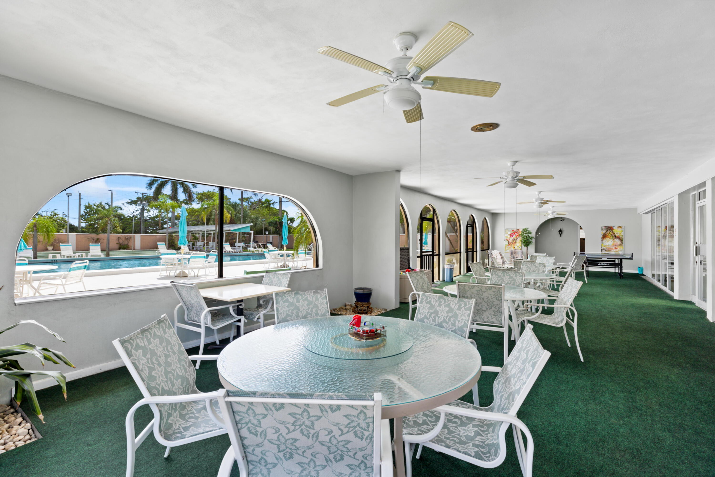 400 Northeast 20th Street, Unit B108 Boca Raton, FL 33431 - Photo 24 of 31 a dining room with furniture a rug and a large window