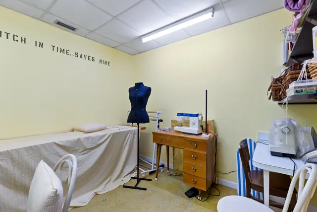 a view of a workspace with furniture