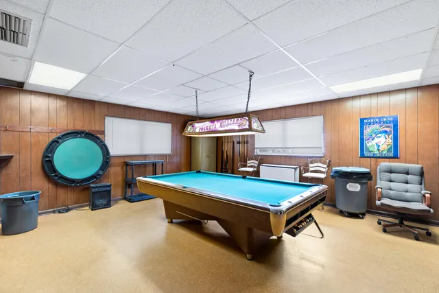 a room with furniture and pool table