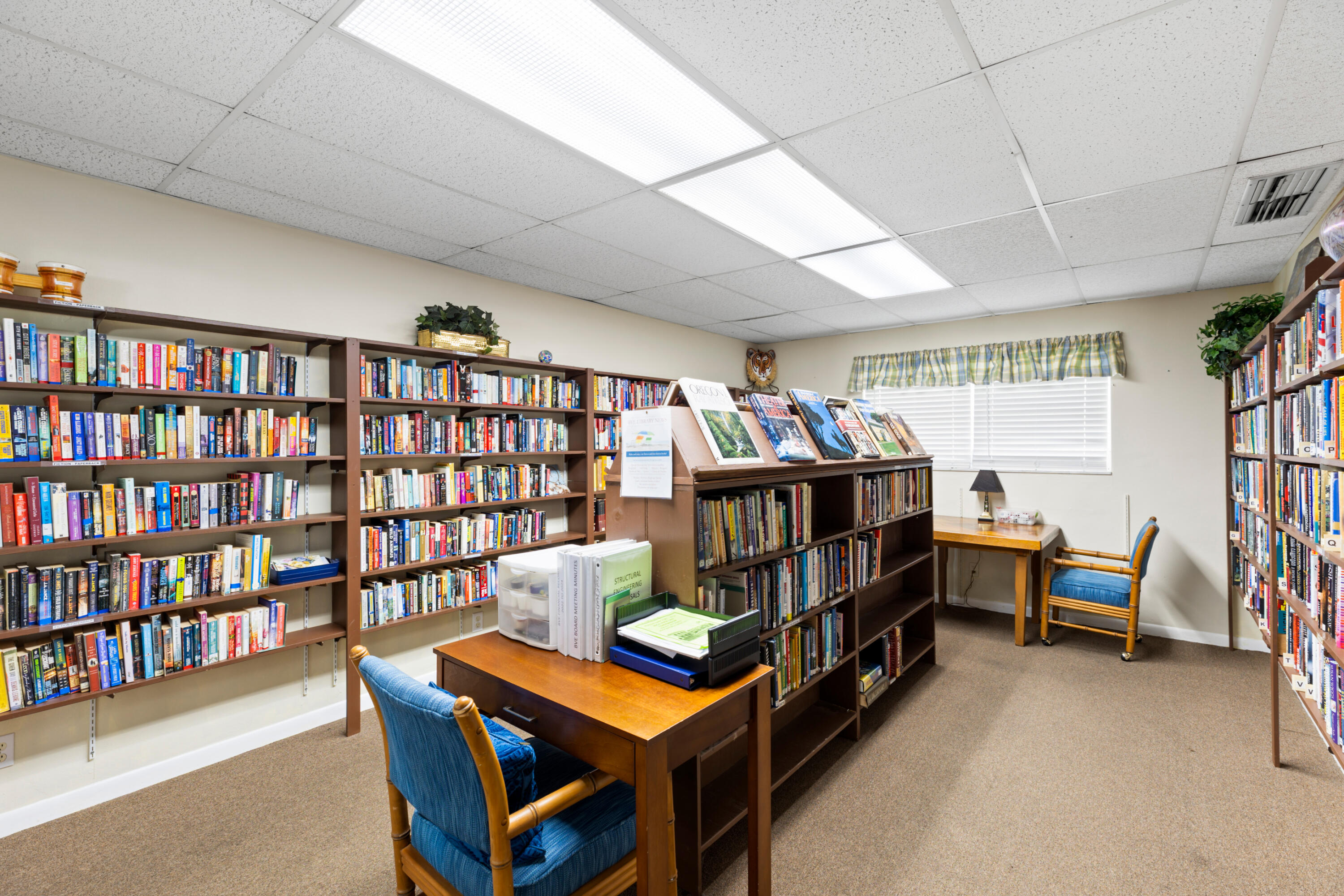 400 Northeast 20th Street, Unit B108 Boca Raton, FL 33431 - Photo 28 of 31 a room with furniture a baby crib and a book shelf
