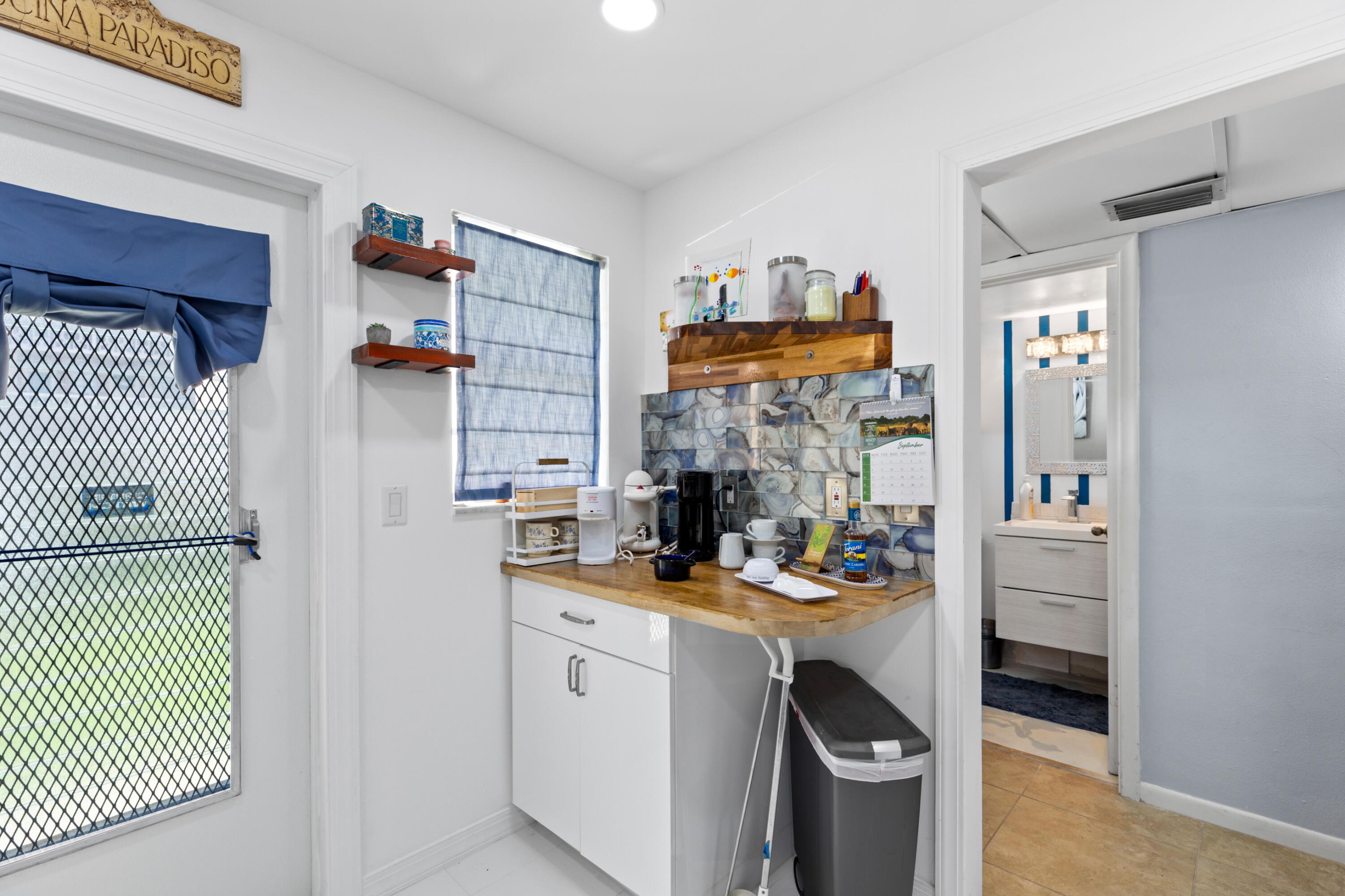 400 Northeast 20th Street, Unit B108 Boca Raton, FL 33431 - Photo 8 of 31 a room with storage and utility