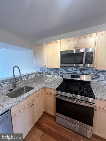 a bathroom with a sink and mirror