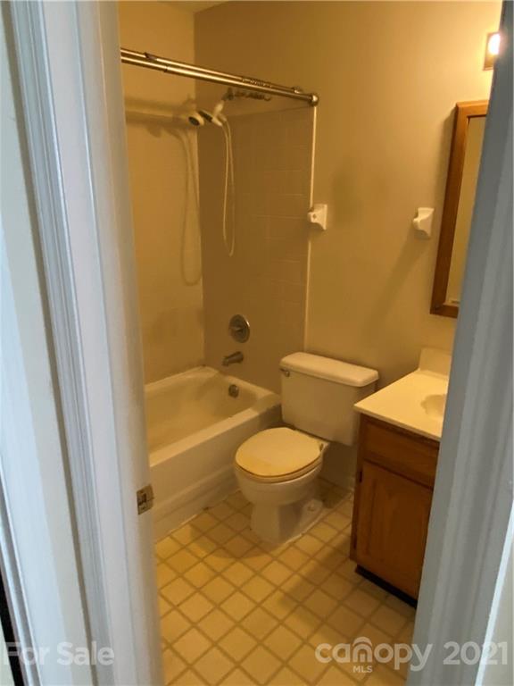19839 Henderson Road, Unit A Cornelius, NC 28031 - Photo 14 of 23 a bathroom with a toilet and a shower