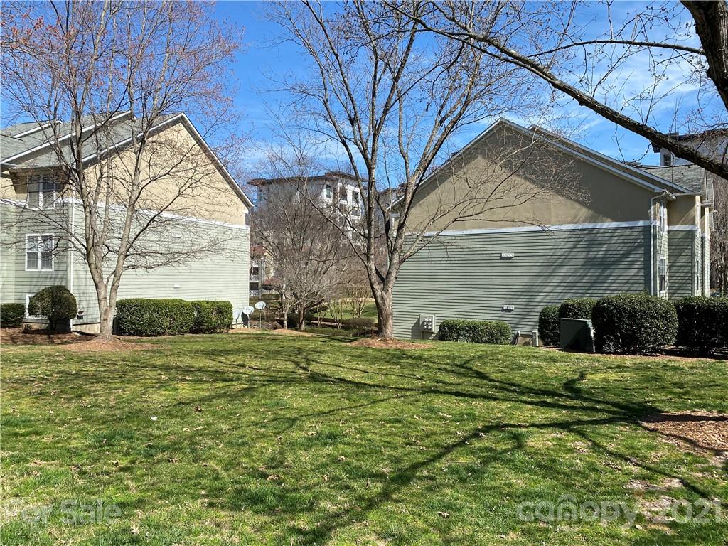 19839 Henderson Road, Unit A Cornelius, NC 28031 - Photo 3 of 23 a view of a house with a yard