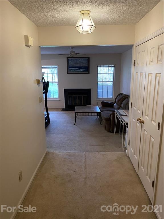 19839 Henderson Road, Unit A Cornelius, NC 28031 - Photo 5 of 23 a view of a livingroom with furniture and windows