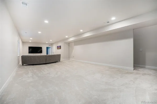 a view of kitchen and empty room