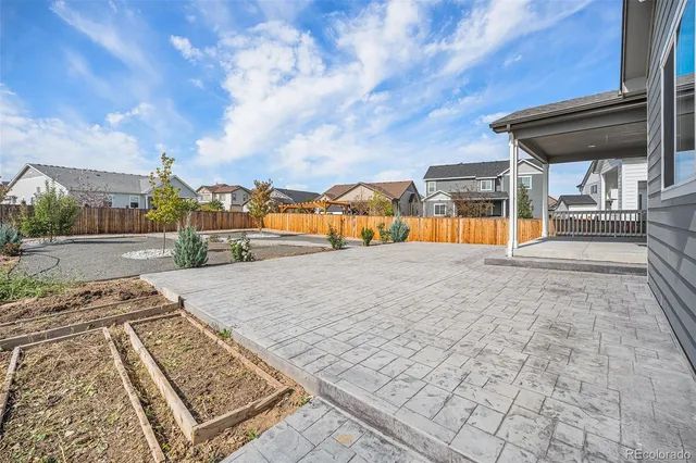a front view of a house with a yard and a garage