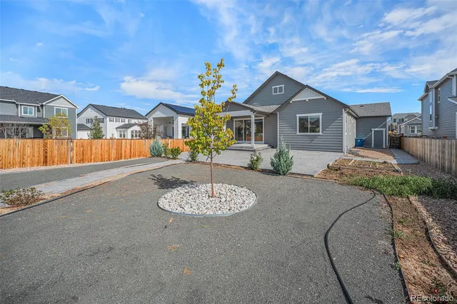 an aerial view of a house with a ocean view