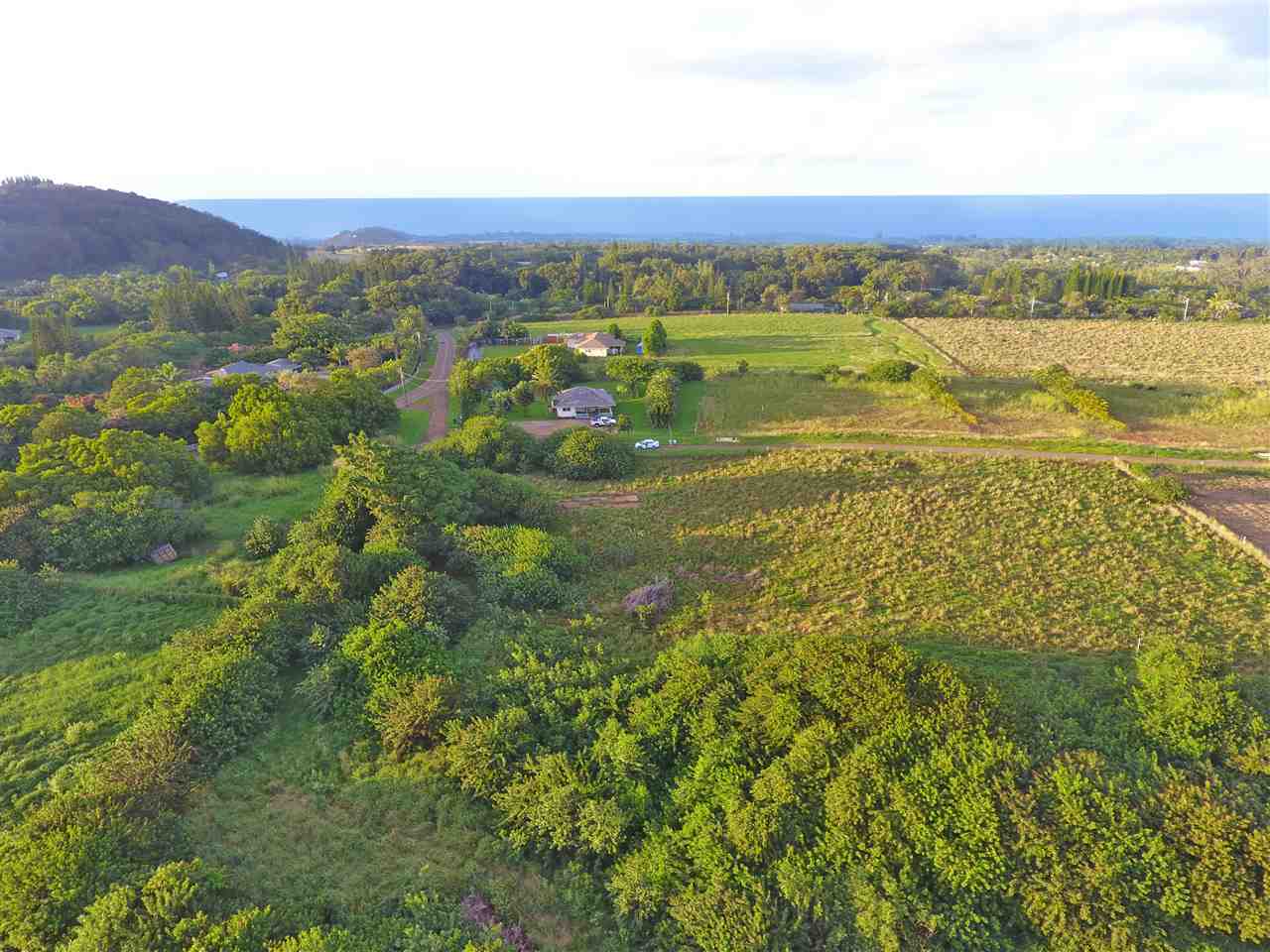 1855 Kauhikoa Road, Unit 223B Haiku, HI 96708 - Photo 5 of 9 a view of an ocean and a mountain