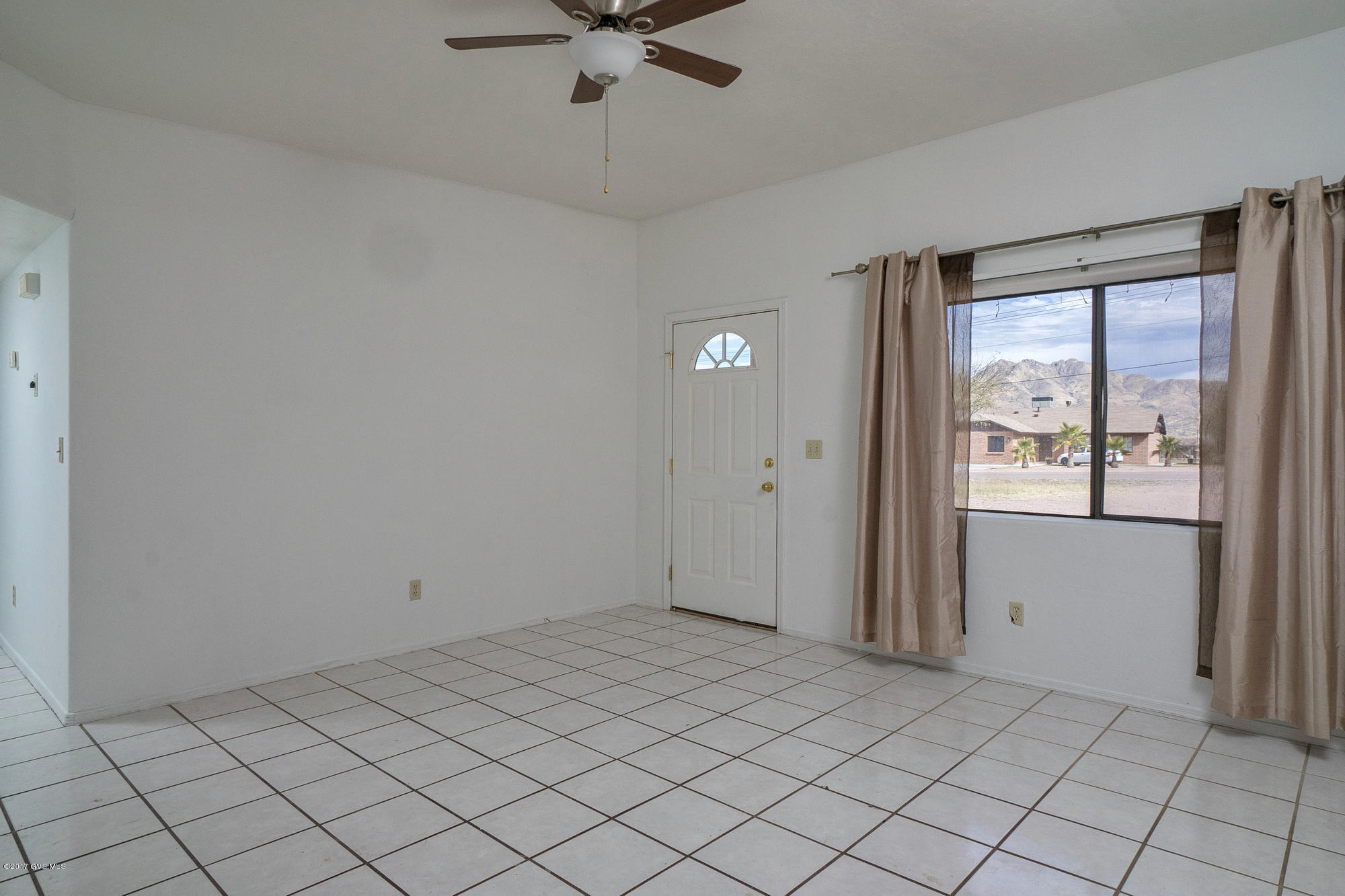 1308 Calle Cherokee Rio Rico, AZ 85648 - Photo 4 of 15 a view of an empty room and window