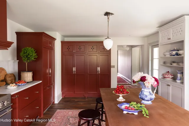 a bedroom with a bed and a potted plant