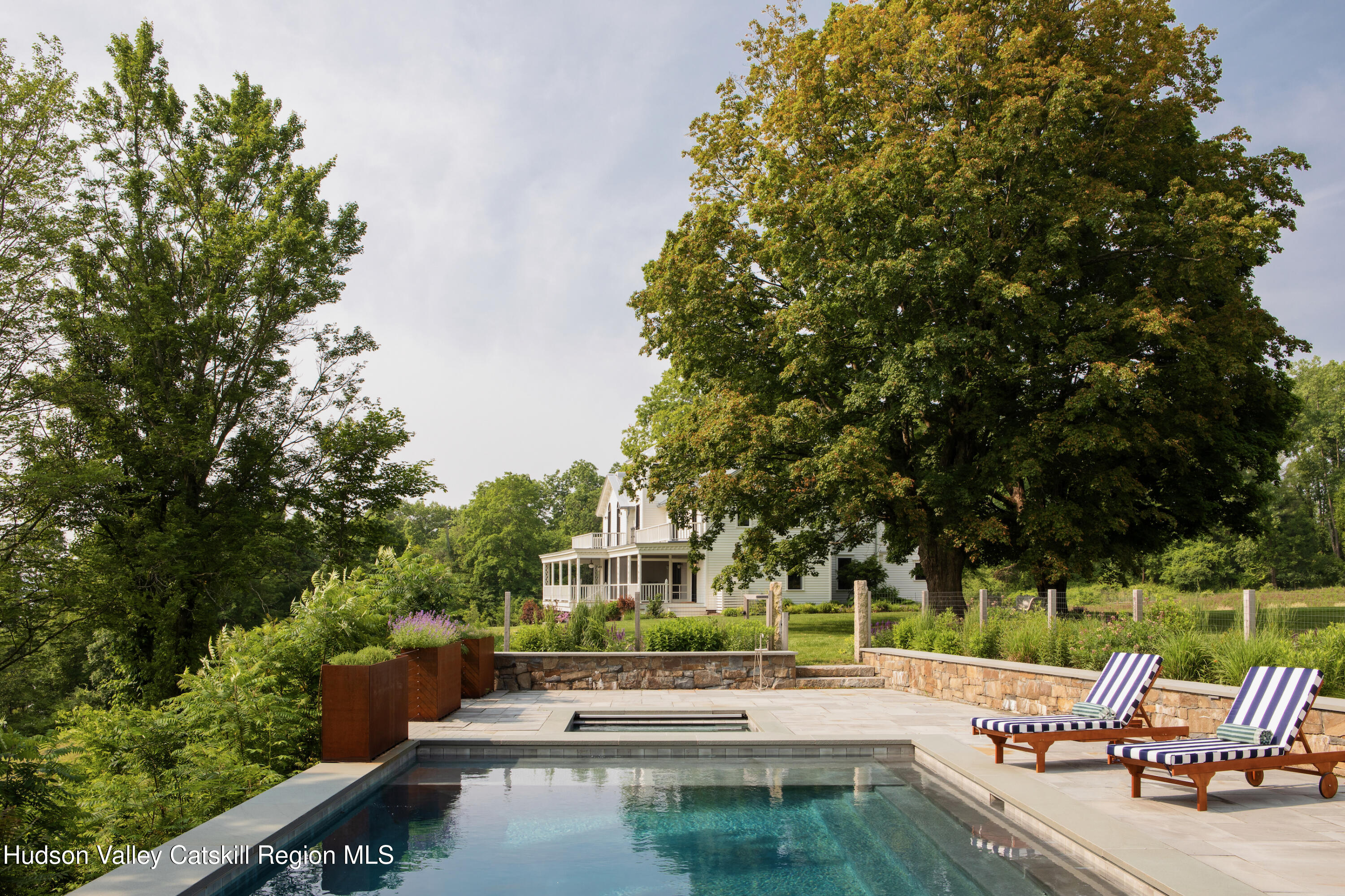 290 Ulster Landing Road Kingston, NY 12401 - Photo 3 of 89 a view of a swimming pool with lawn chairs and a fire pit