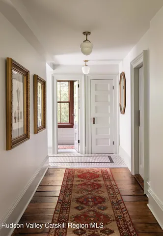 an aerial view of a house with a yard basket ball court and outdoor seating
