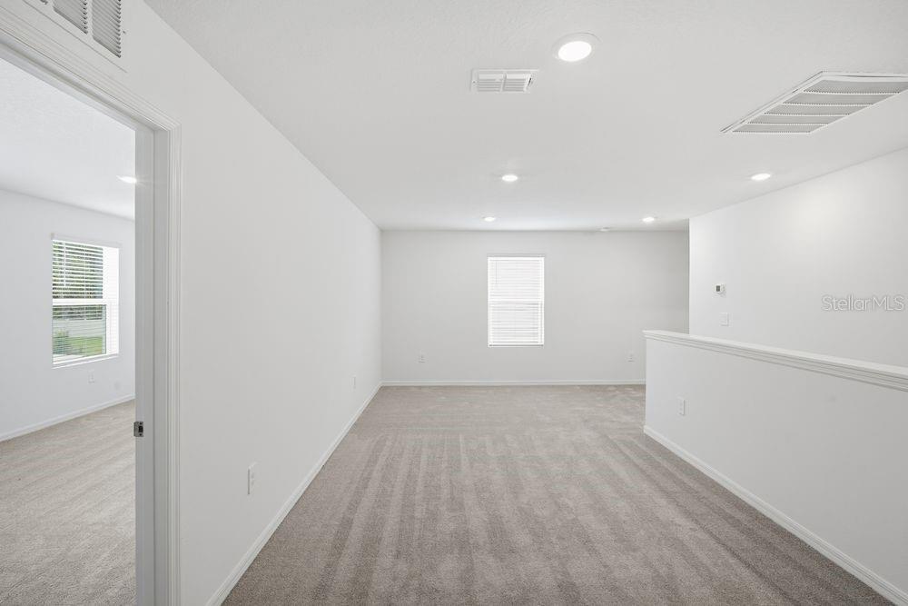 13245 Tropical Breeze Way Hudson, FL 34669 - Photo 20 of 41 an empty room with windows