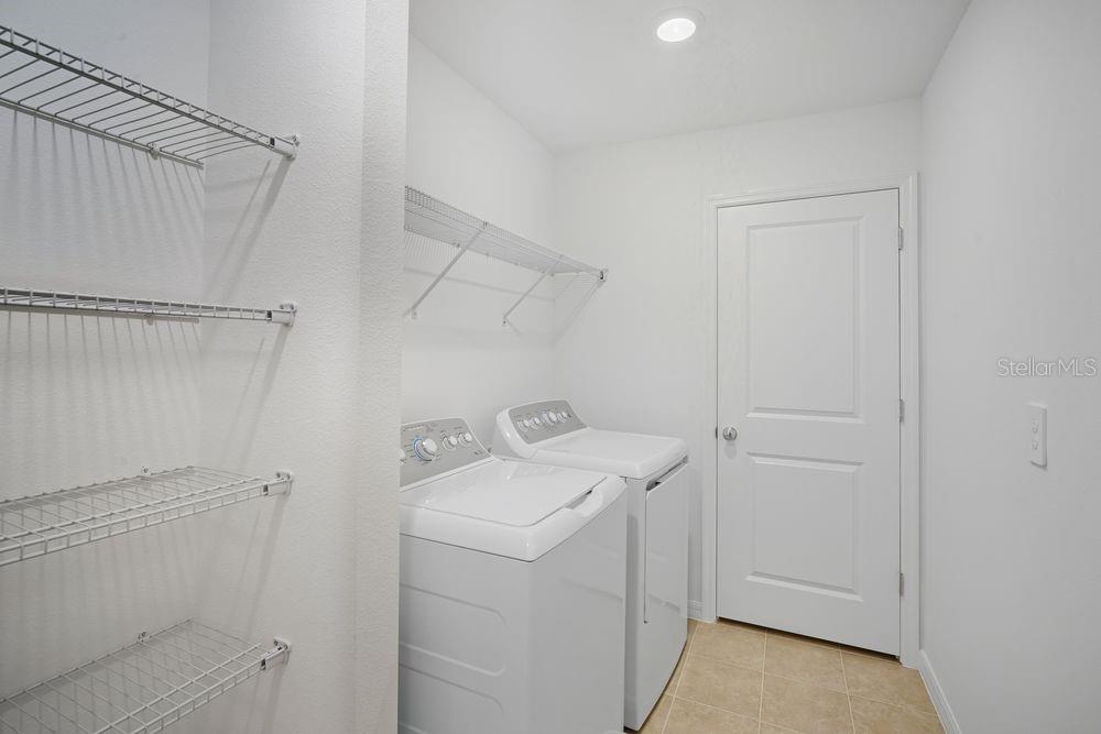 13245 Tropical Breeze Way Hudson, FL 34669 - Photo 24 of 41 a utility room with dryer and washer