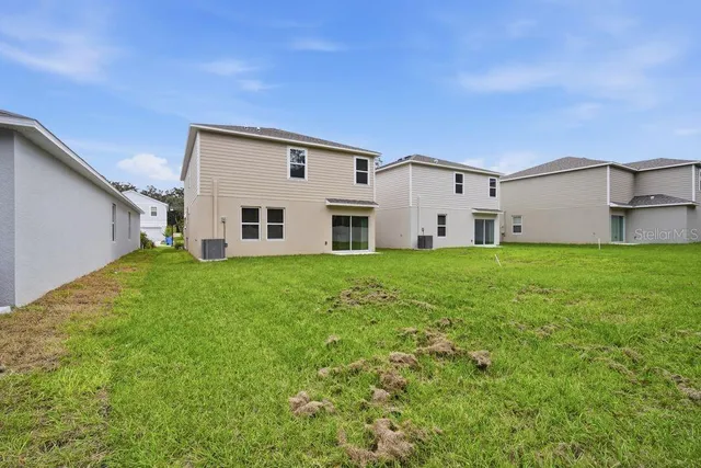 a big house with a big yard and more windows