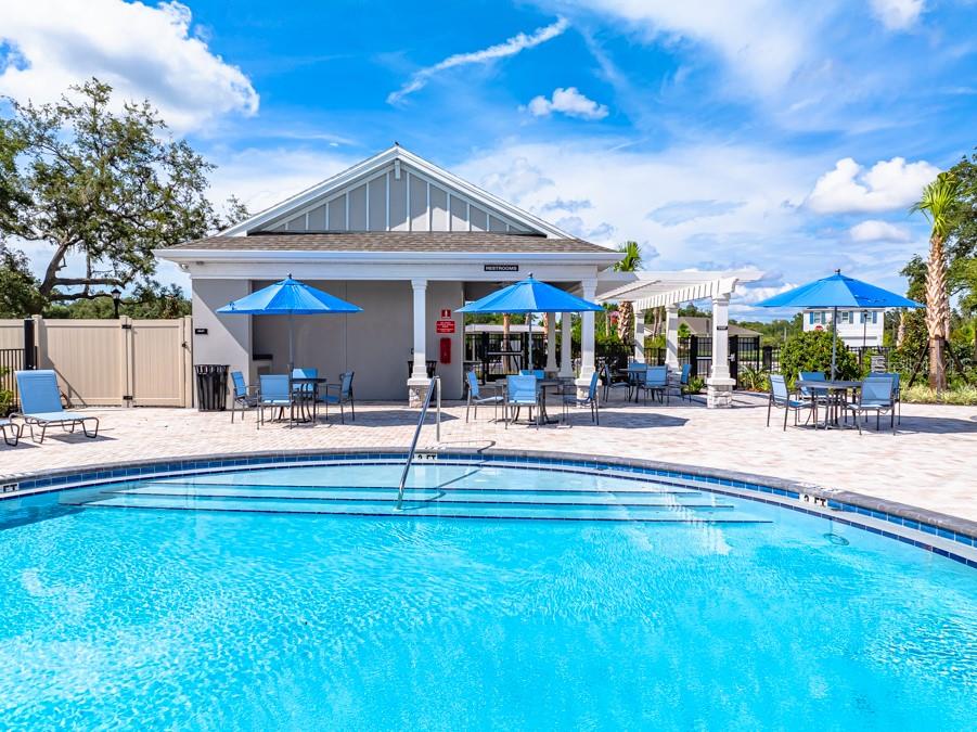 13245 Tropical Breeze Way Hudson, FL 34669 - Photo 34 of 41 a view of a building with a swimming pool