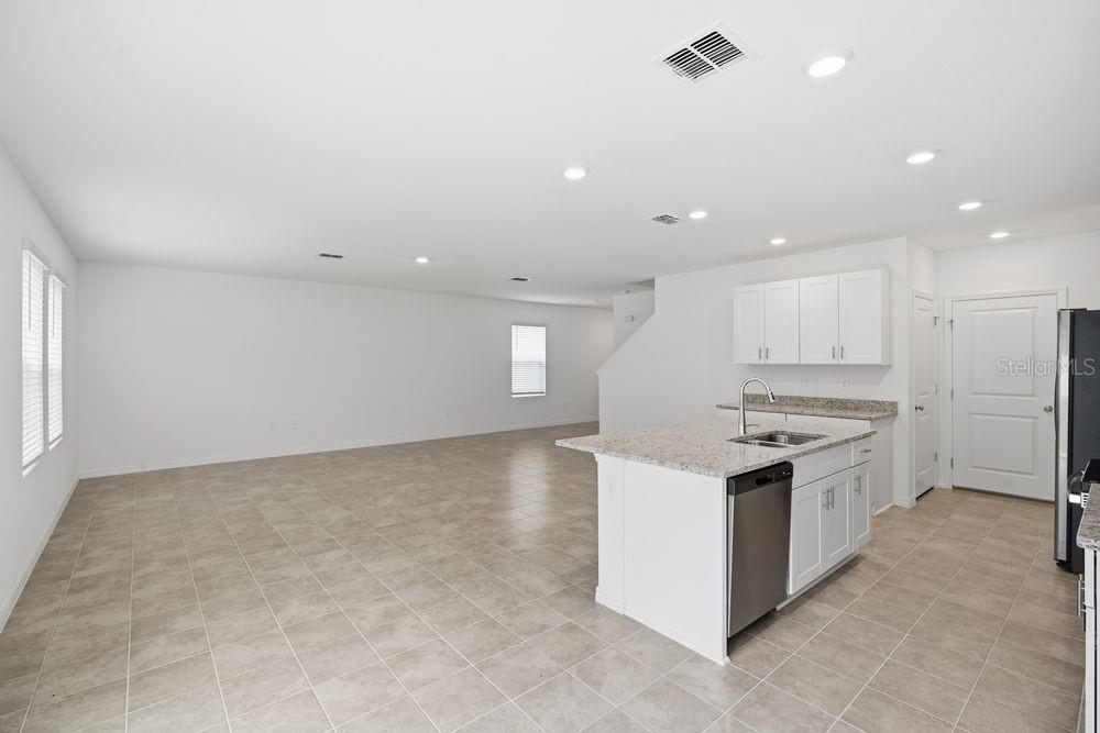 13245 Tropical Breeze Way Hudson, FL 34669 - Photo 6 of 41 a kitchen with a stove a sink and a refrigerator