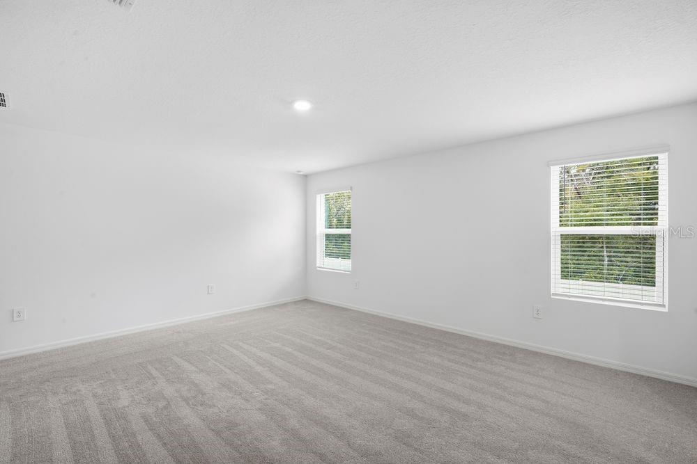 13245 Tropical Breeze Way Hudson, FL 34669 - Photo 7 of 41 an empty room with a window