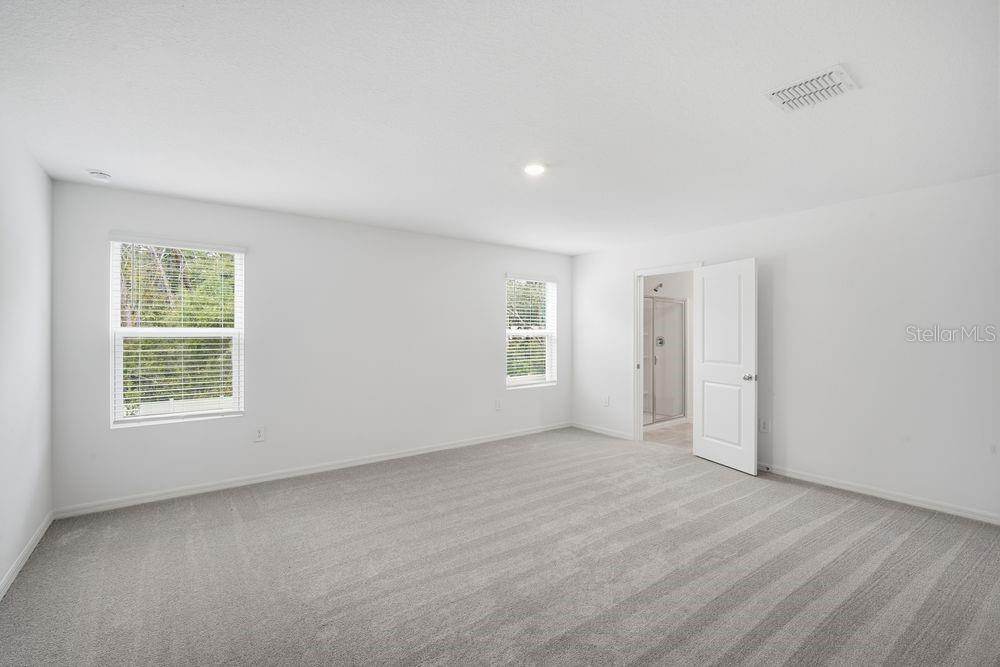 13245 Tropical Breeze Way Hudson, FL 34669 - Photo 8 of 41 an empty room with windows