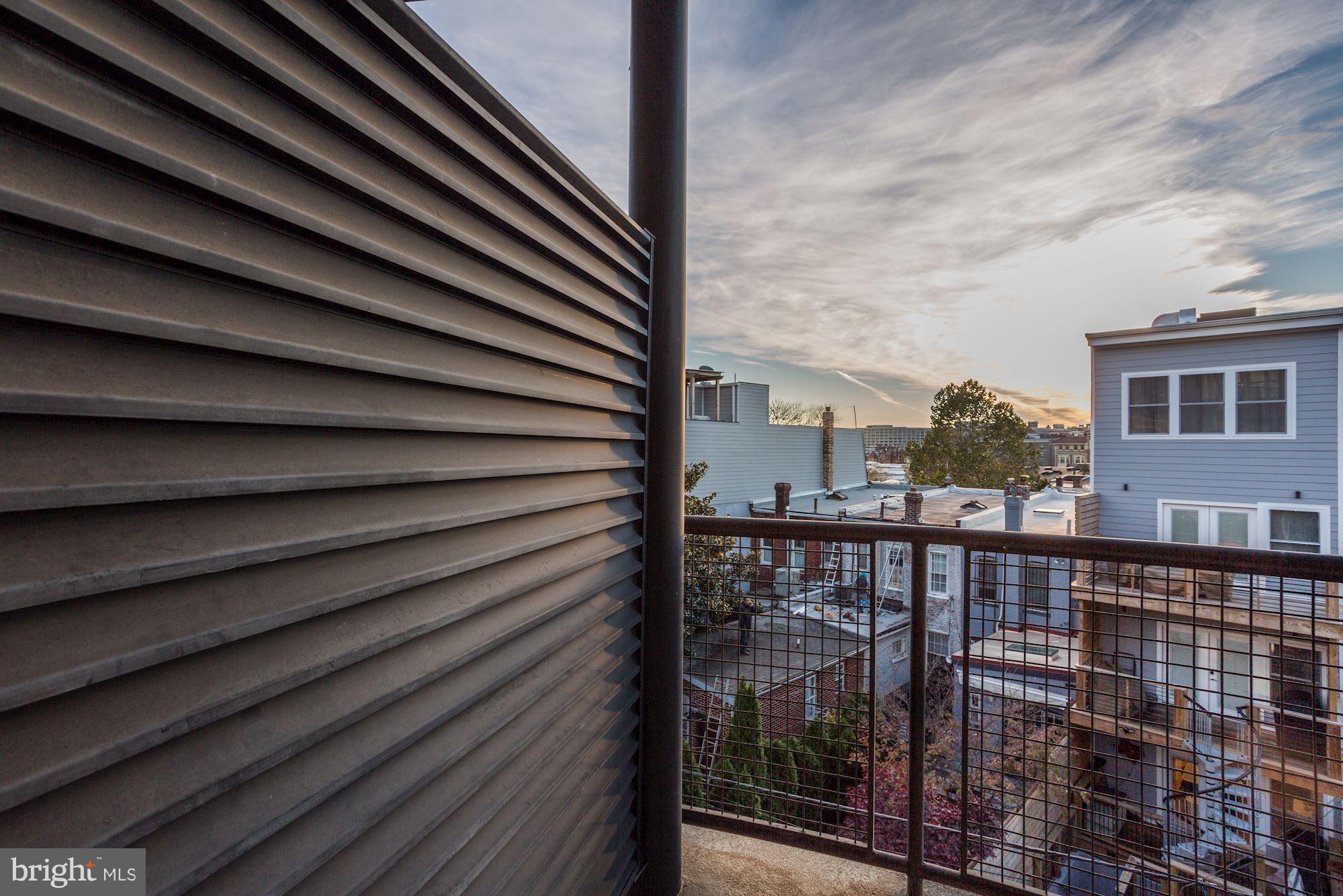 1700 Kalorama Road Northwest, Unit 312 Washington, DC 20009 - Photo 12 of 45 a view of a balcony with a potted plant