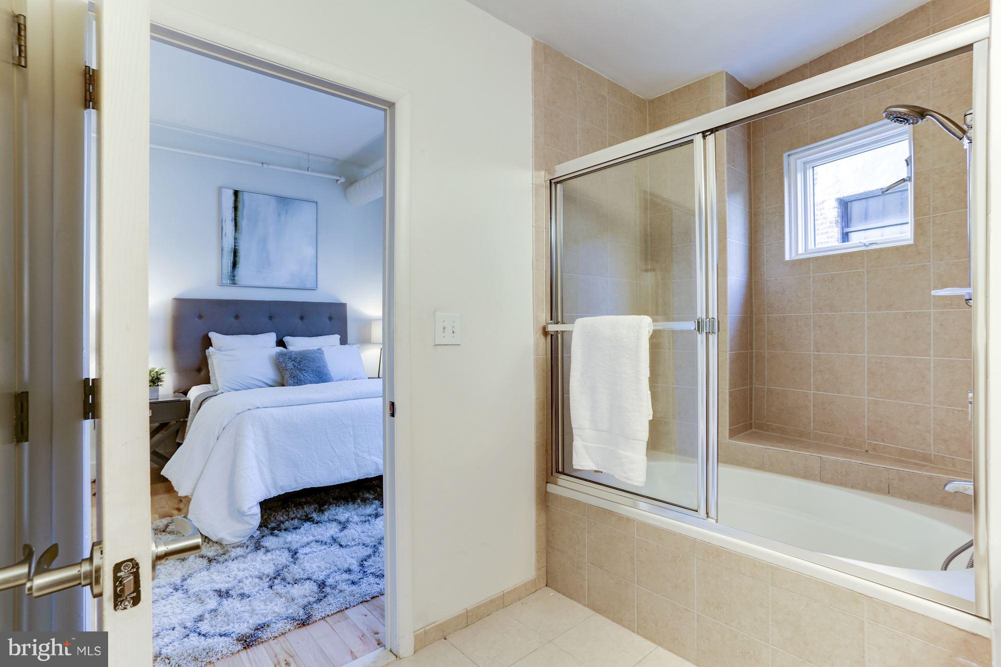 1700 Kalorama Road Northwest, Unit 312 Washington, DC 20009 - Photo 22 of 45 a bathroom with a tub and shower