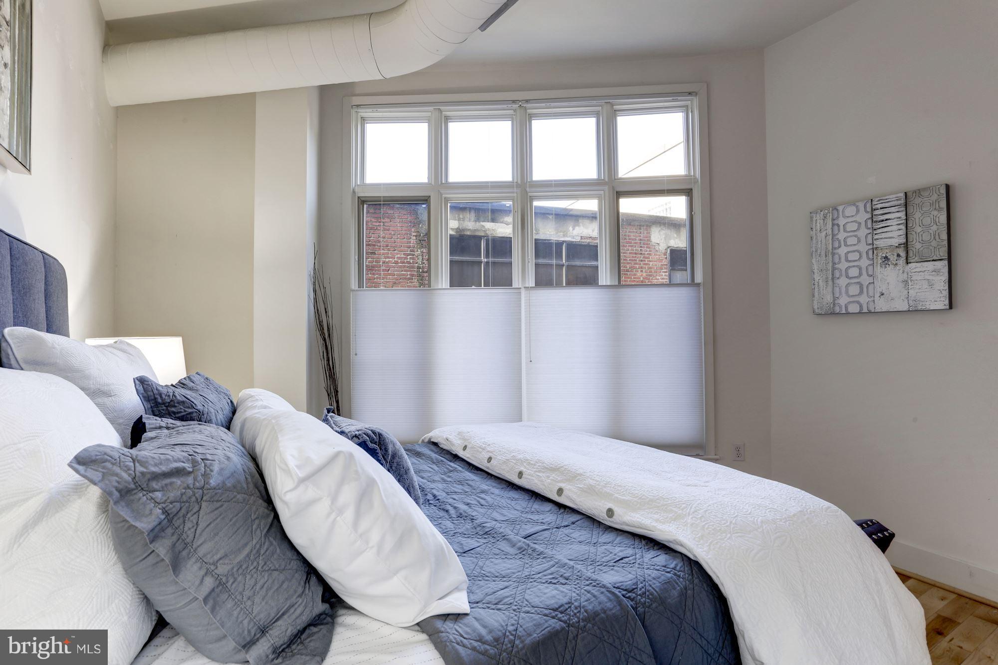 1700 Kalorama Road Northwest, Unit 312 Washington, DC 20009 - Photo 26 of 45 a bedroom with bed and a window