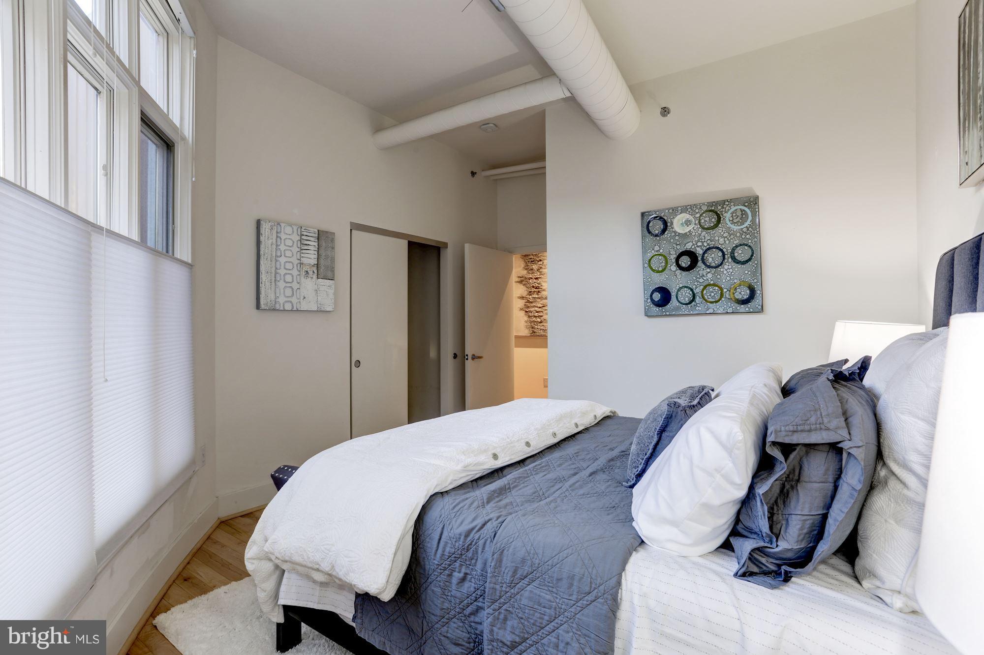 1700 Kalorama Road Northwest, Unit 312 Washington, DC 20009 - Photo 27 of 45 a bedroom with a bed and a desk