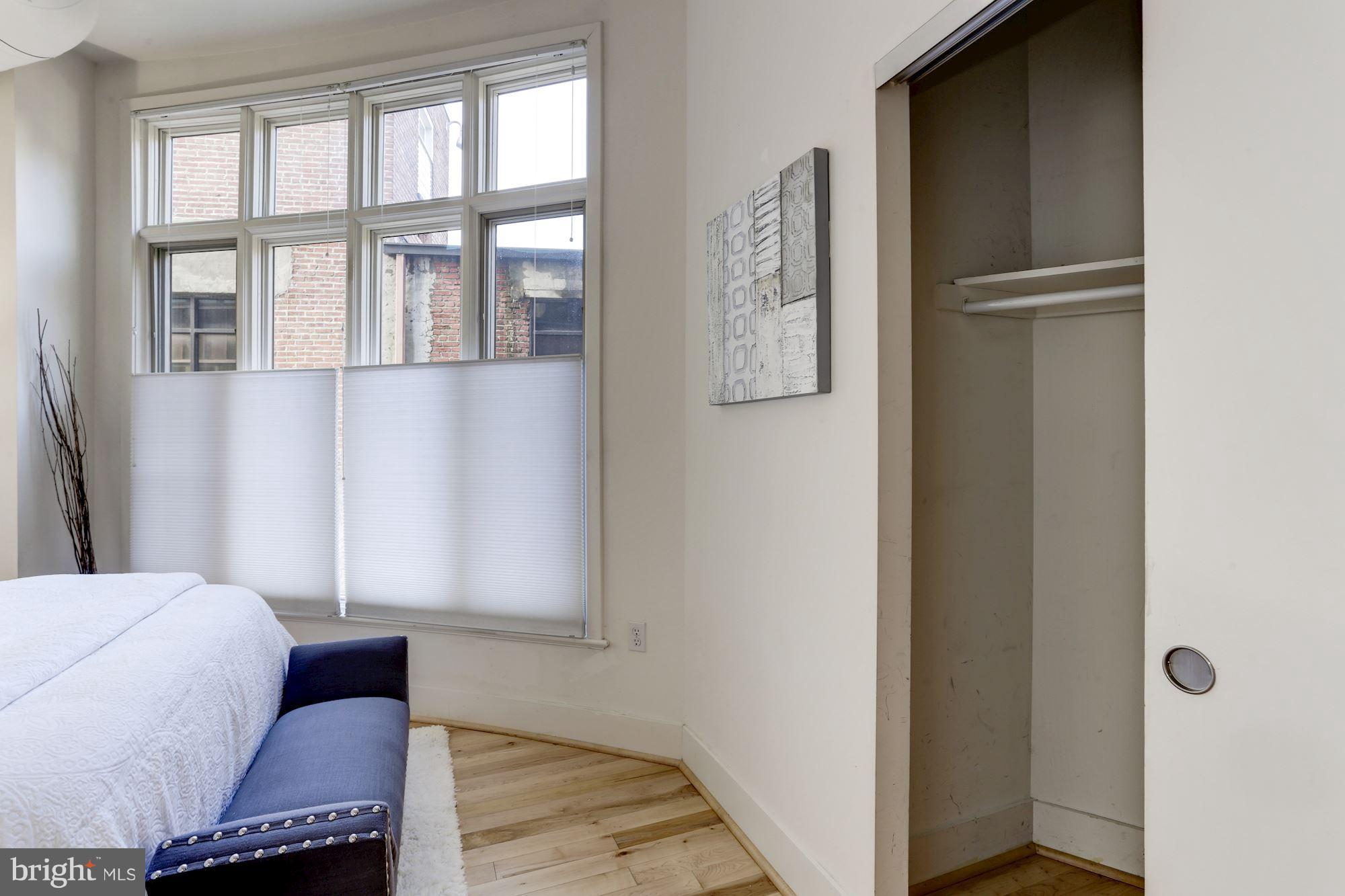 1700 Kalorama Road Northwest, Unit 312 Washington, DC 20009 - Photo 28 of 45 a bedroom with a bed and a window