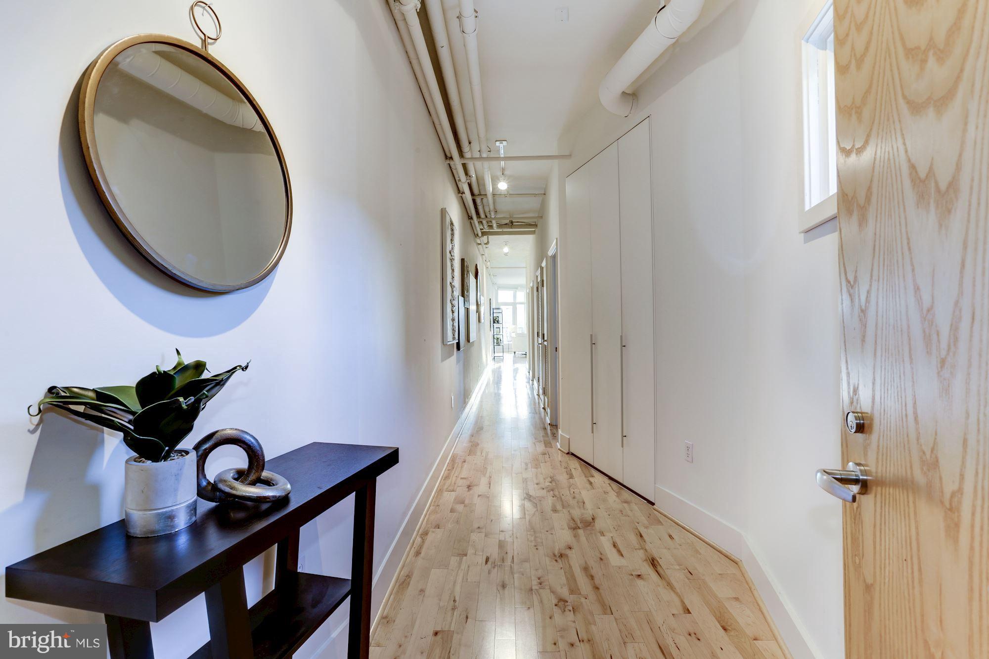 1700 Kalorama Road Northwest, Unit 312 Washington, DC 20009 - Photo 4 of 45 a living room with furniture and a wooden floor
